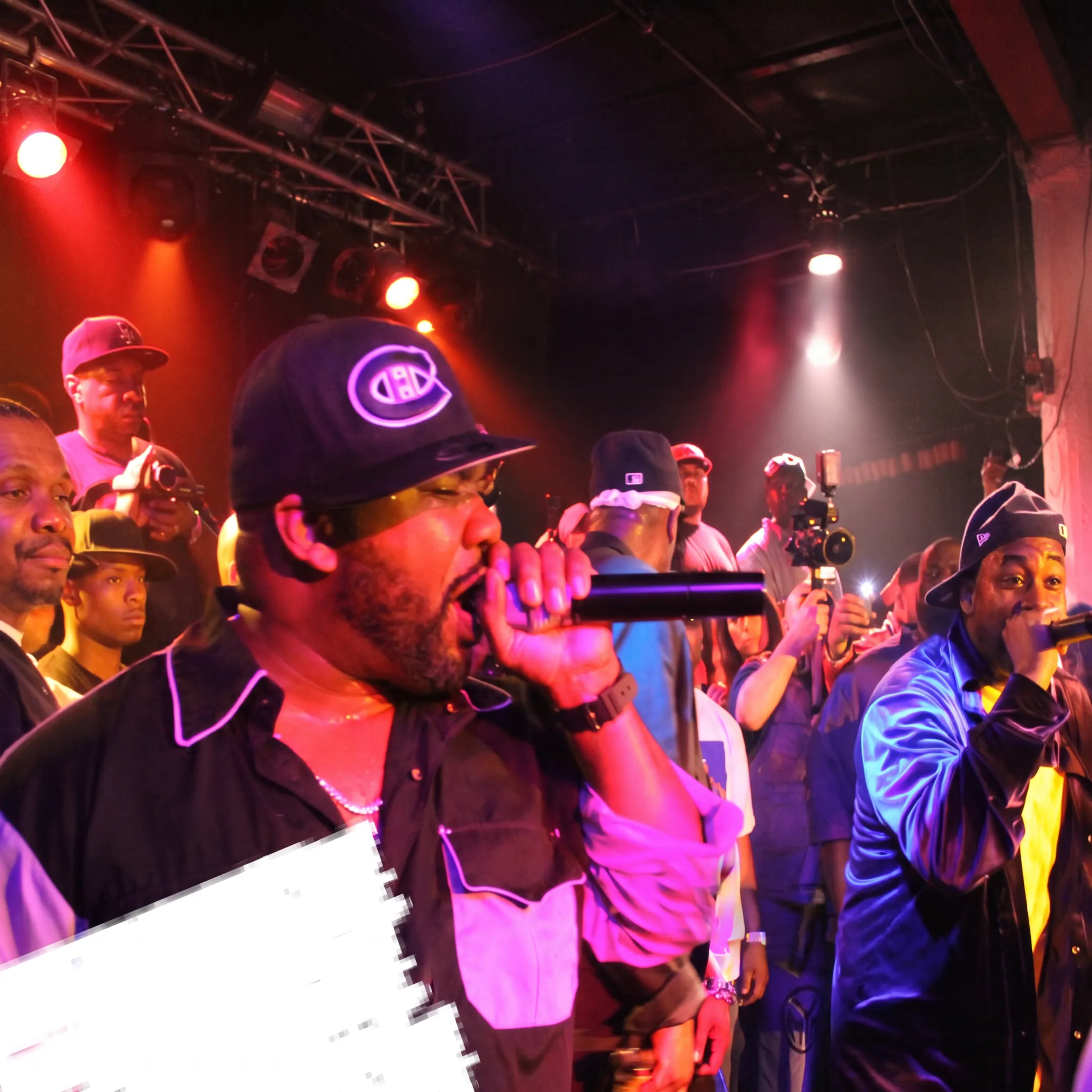 Event production team coordinating a live concert with performers and guests
