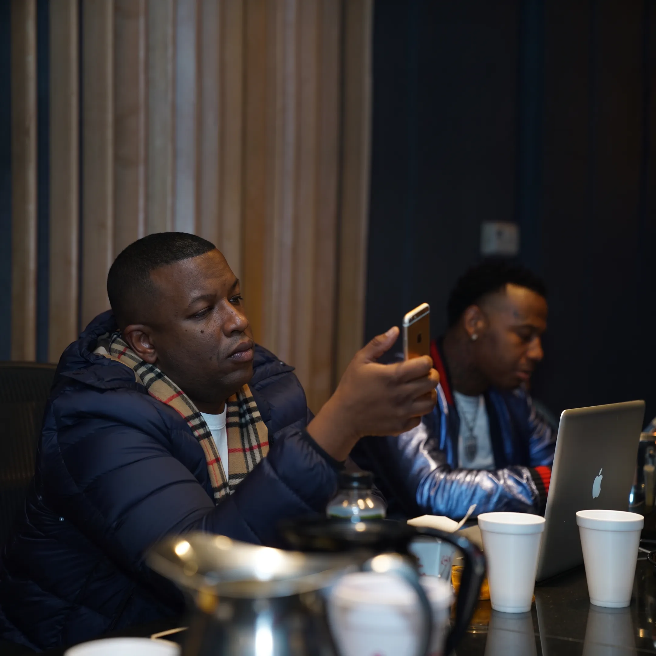 Artist management team planning a music rollout around a conference table