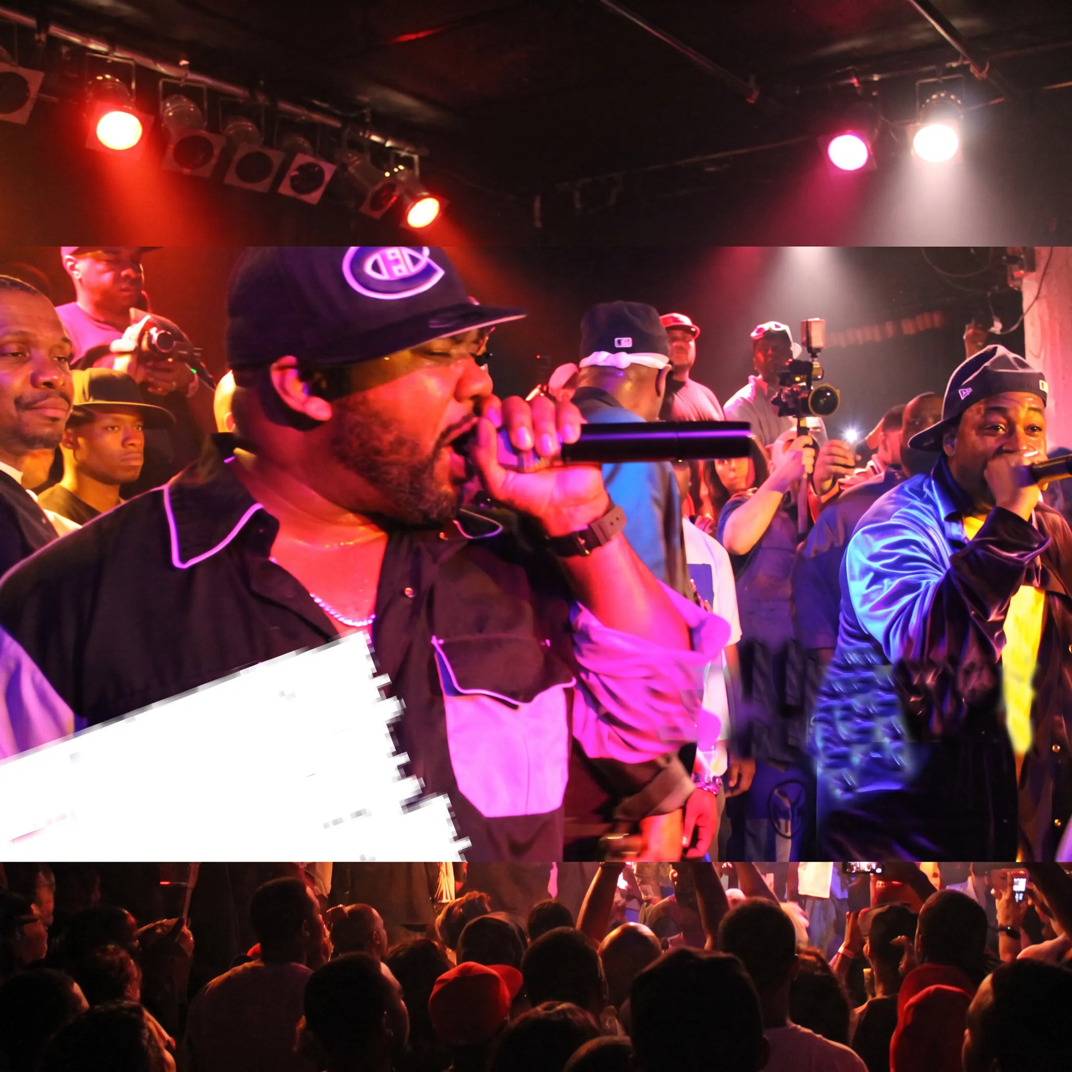 Live artist performing onstage before an engaged Philadelphia audience
