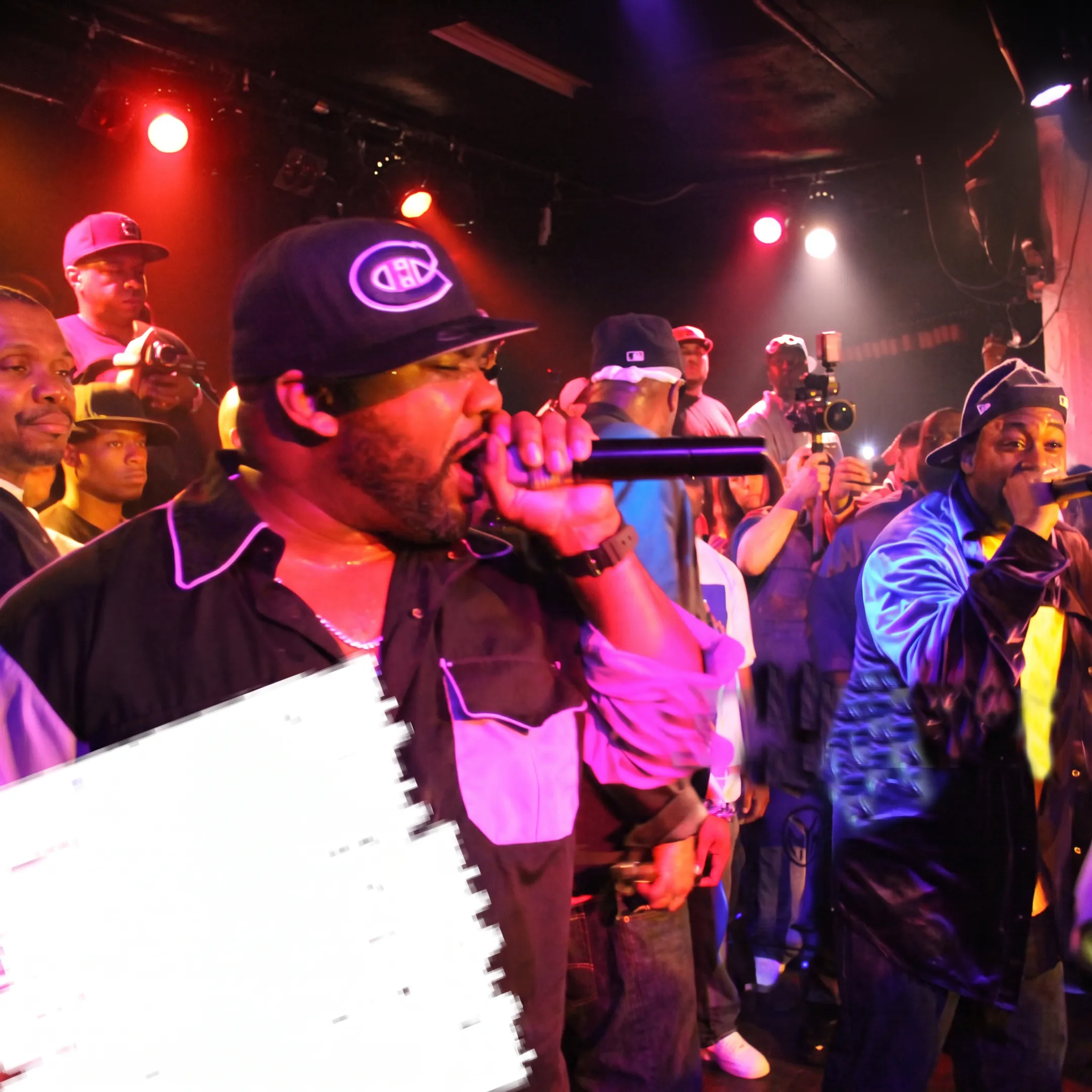 Live concert production with performers, stage lighting, and an engaged Atlanta audience