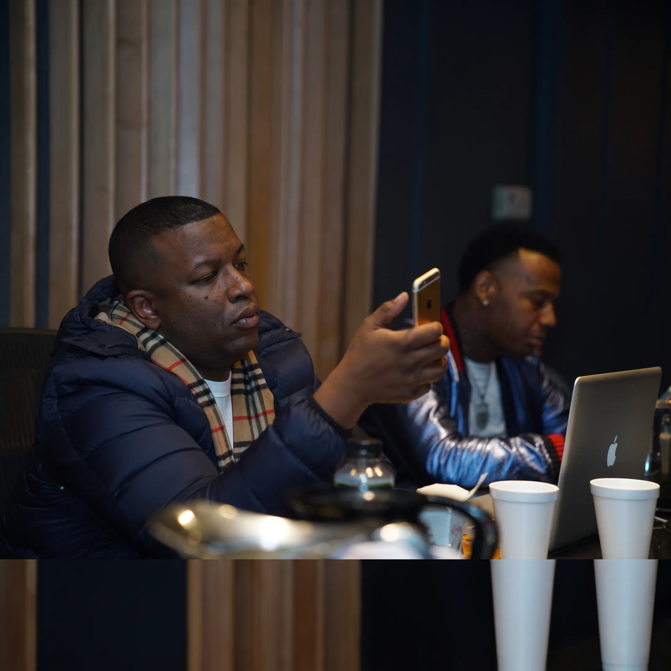 Entertainment manager advising an artist during a focused creative strategy meeting