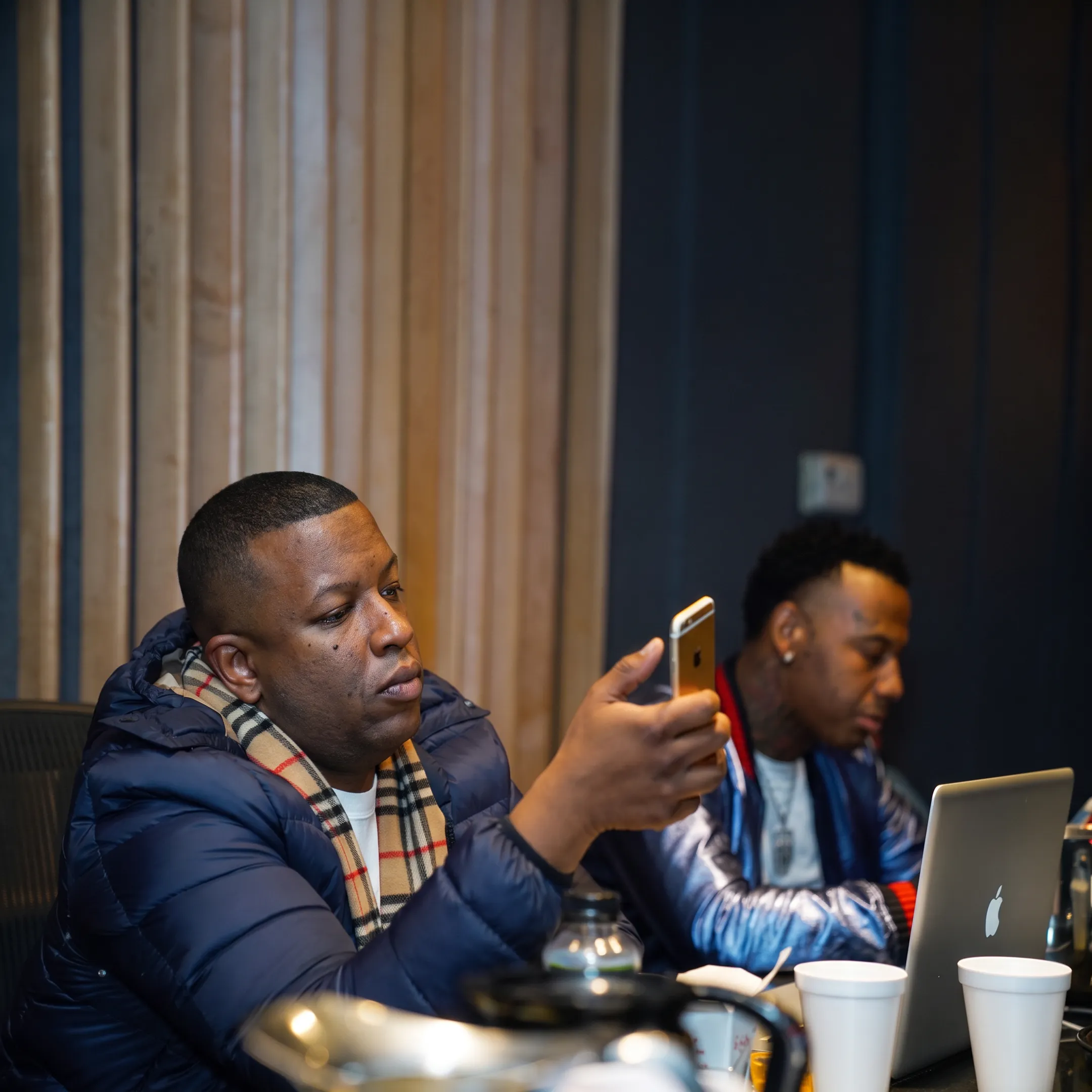 Music promotion team planning an artist campaign in a Chicago studio
