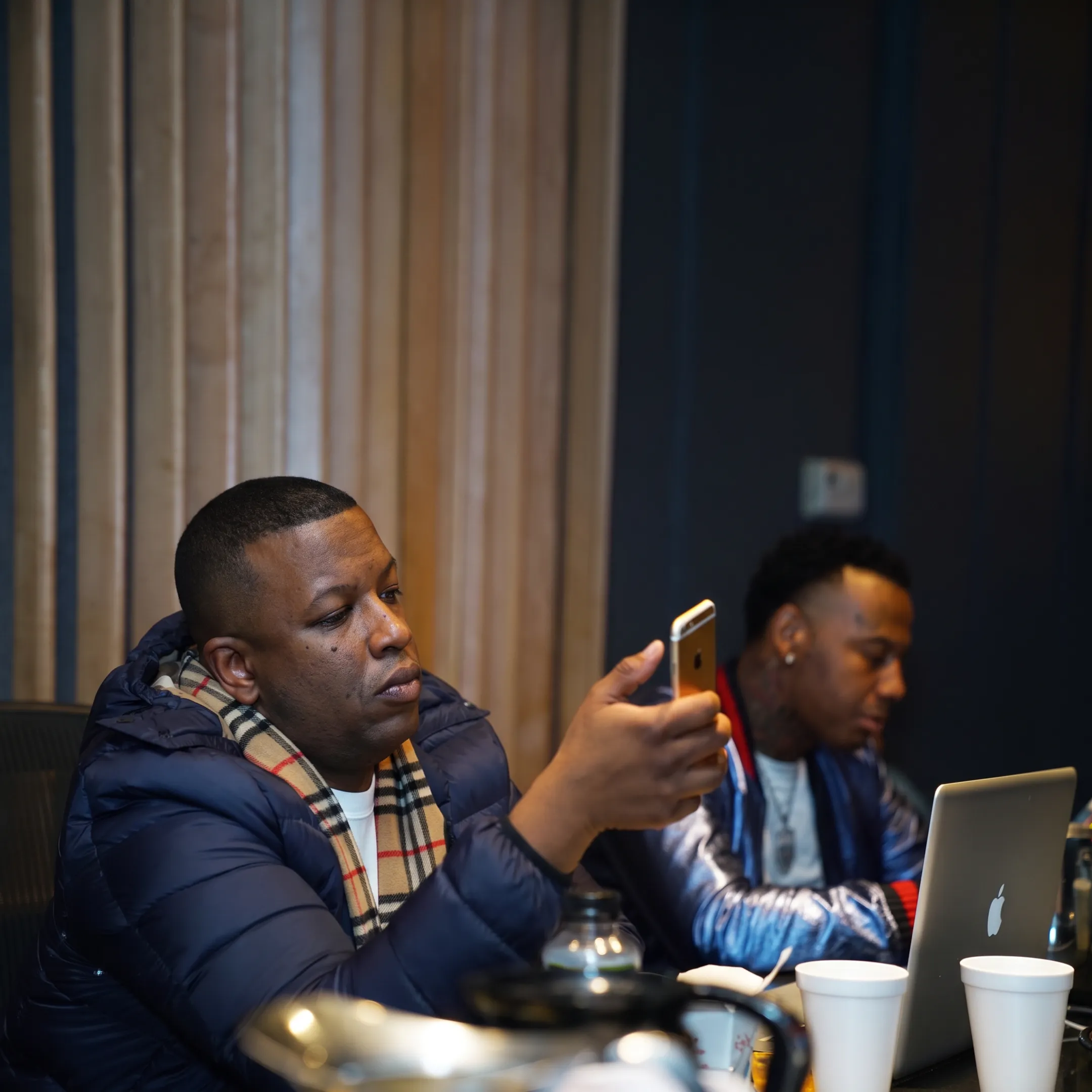 Music booking professional reviewing tour plans with a band