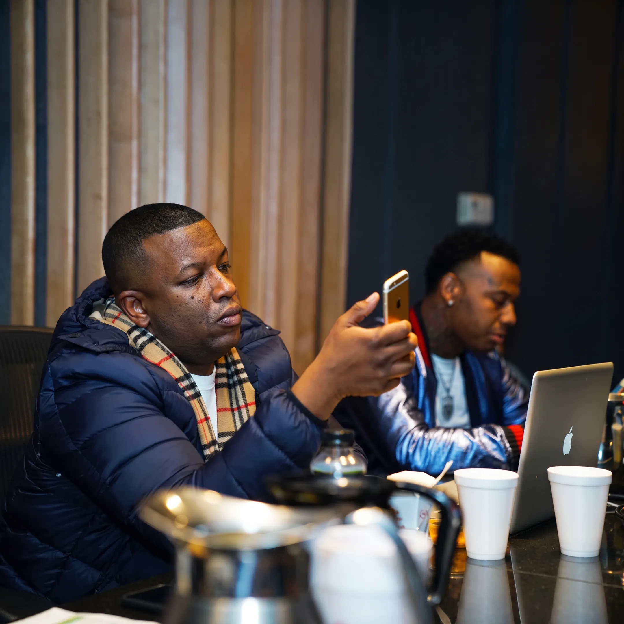 Music promoter coordinating an artist campaign with event and media planning materials