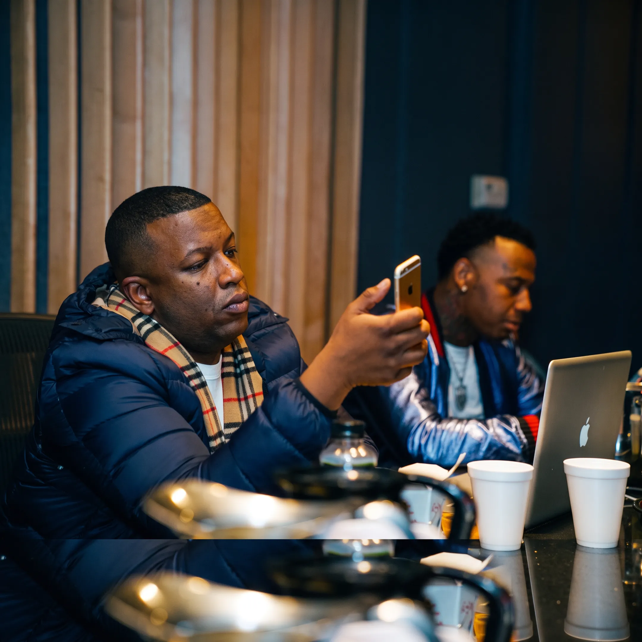 Artist and manager planning music career growth around a table
