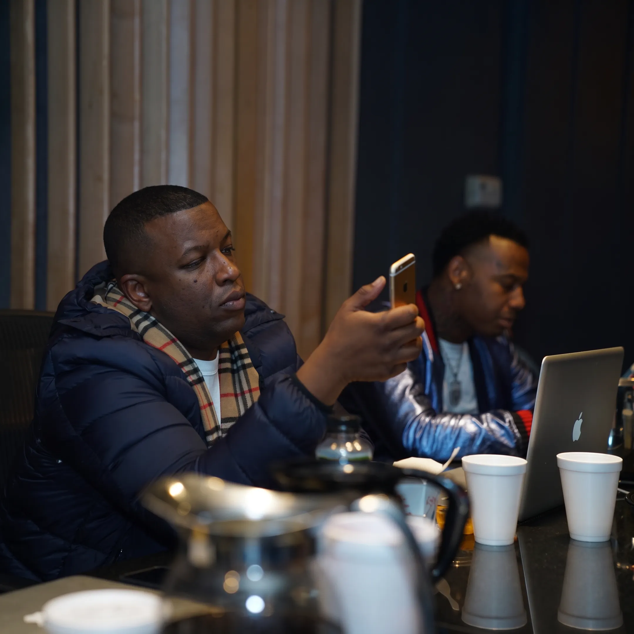 Music marketing team planning an artist campaign in a studio setting
