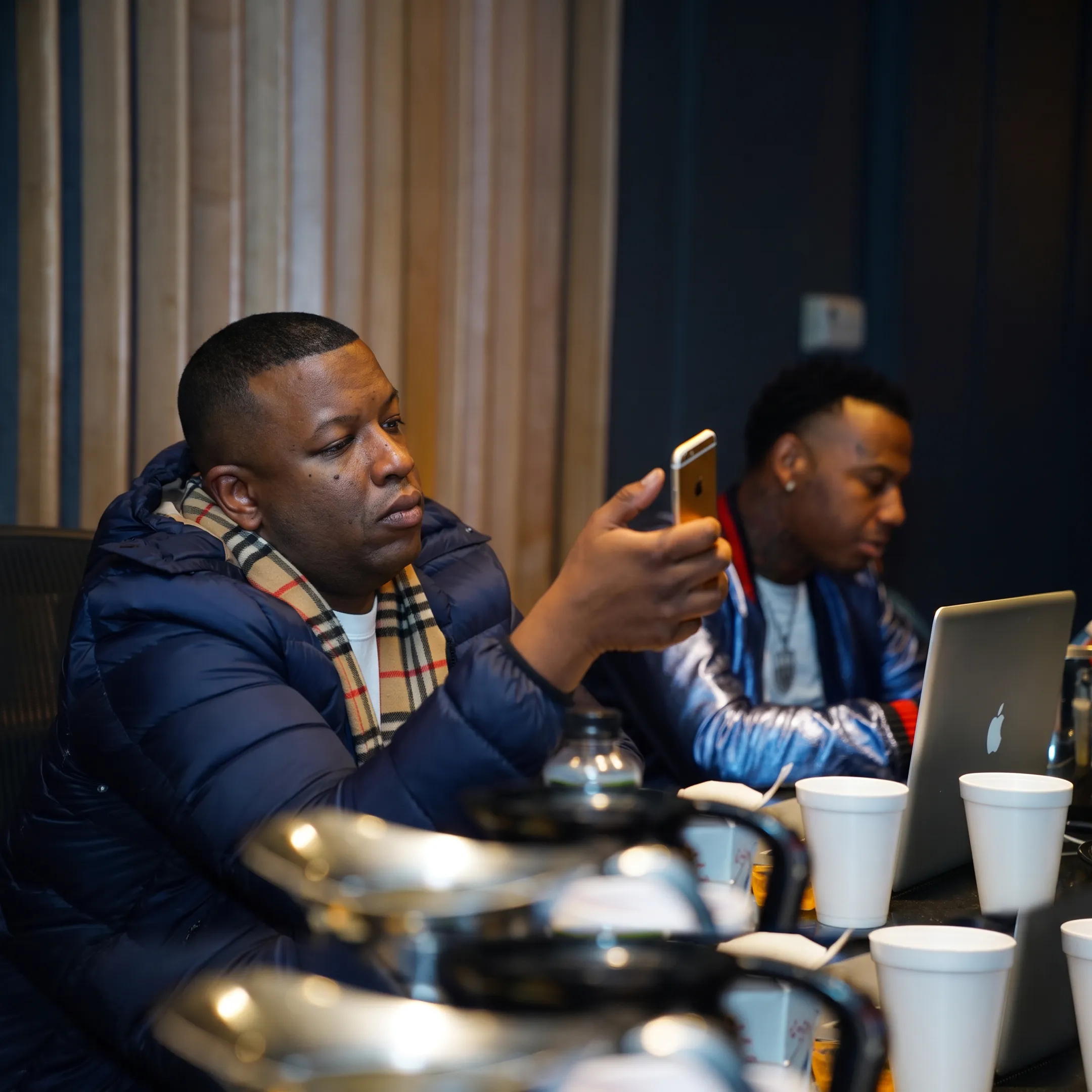Music PR team planning an artist publicity campaign in a modern studio