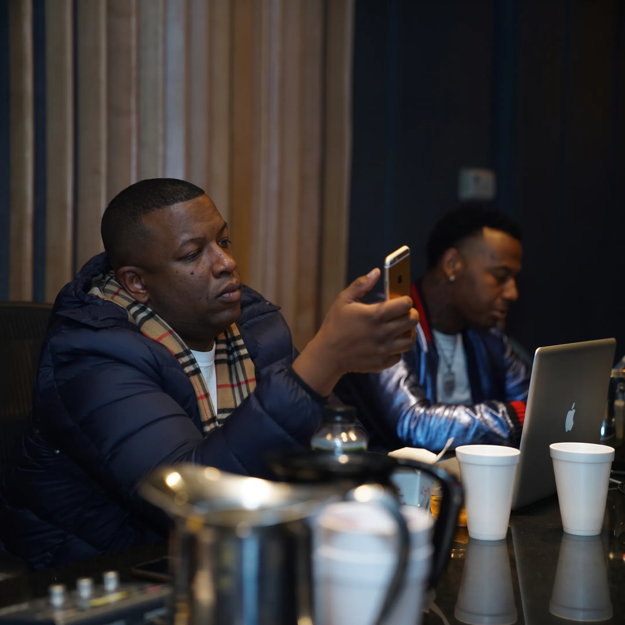 Artist manager meeting with musician in a professional studio setting