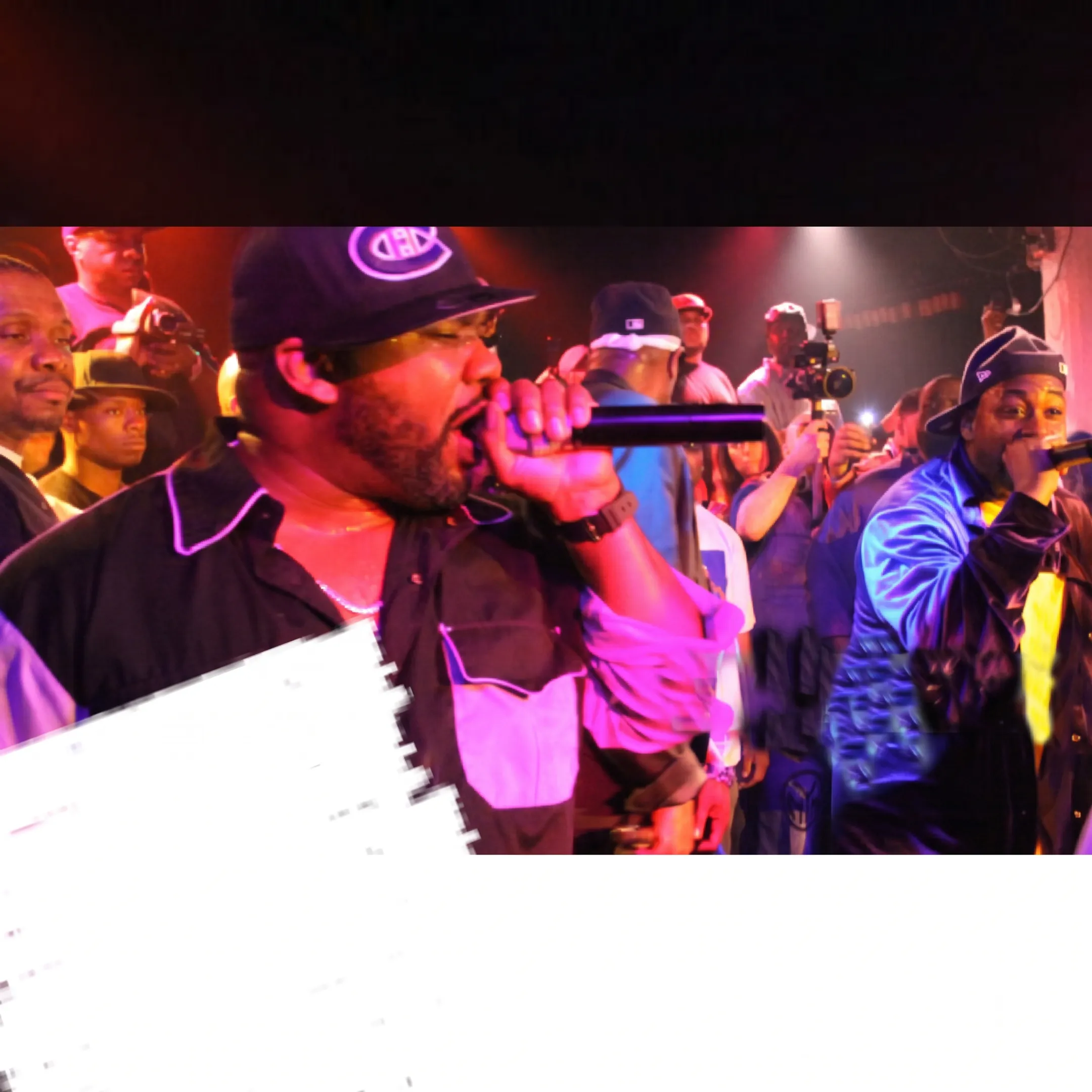 Producer directing a live entertainment event with artists and guests in a Detroit venue