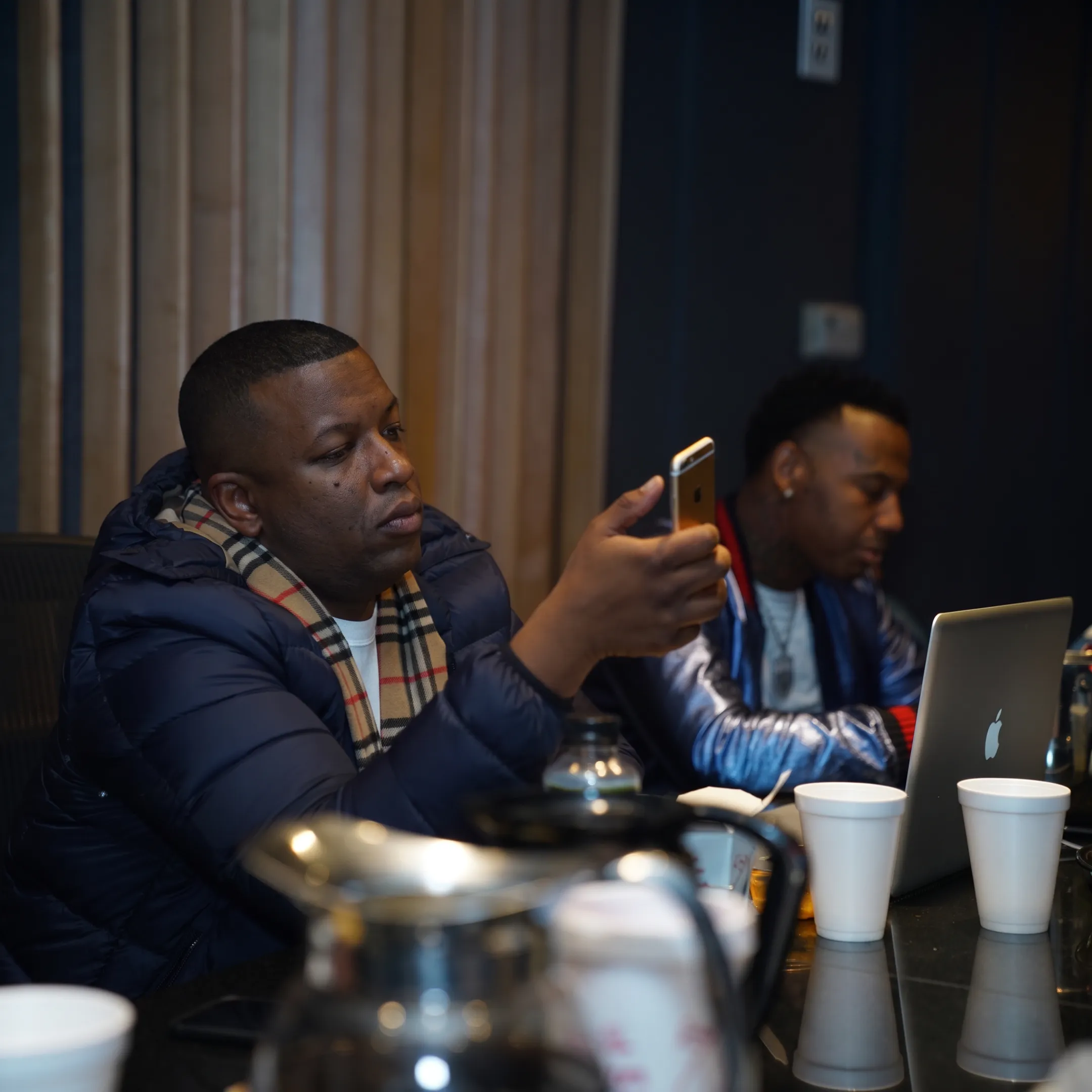 Music marketing team planning an organic artist promotion campaign with release strategy notes and creative materials