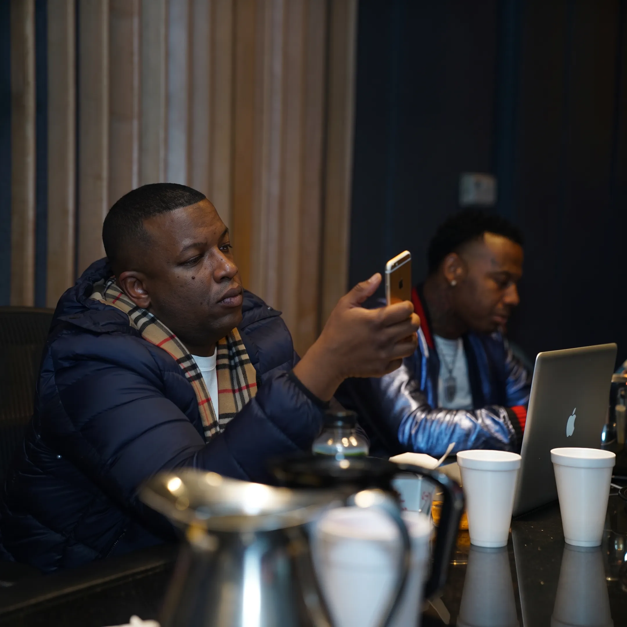 Entertainment manager discussing tour dates and performance opportunities with an artist