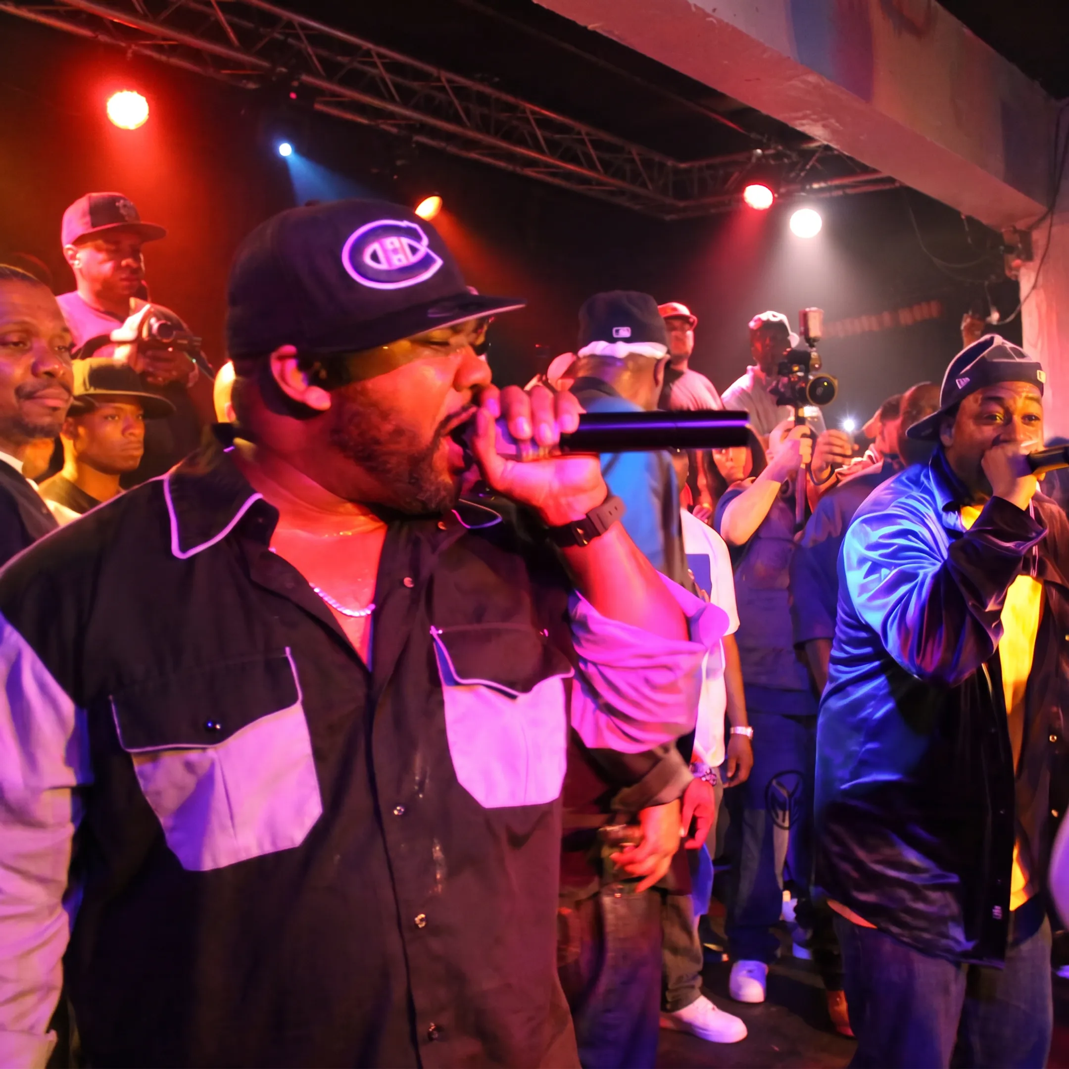 Singer performing onstage before an engaged live audience