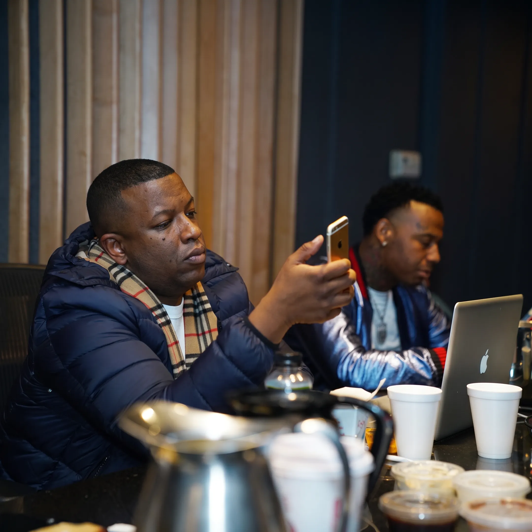 Music booking agent discussing a performance opportunity with an artist