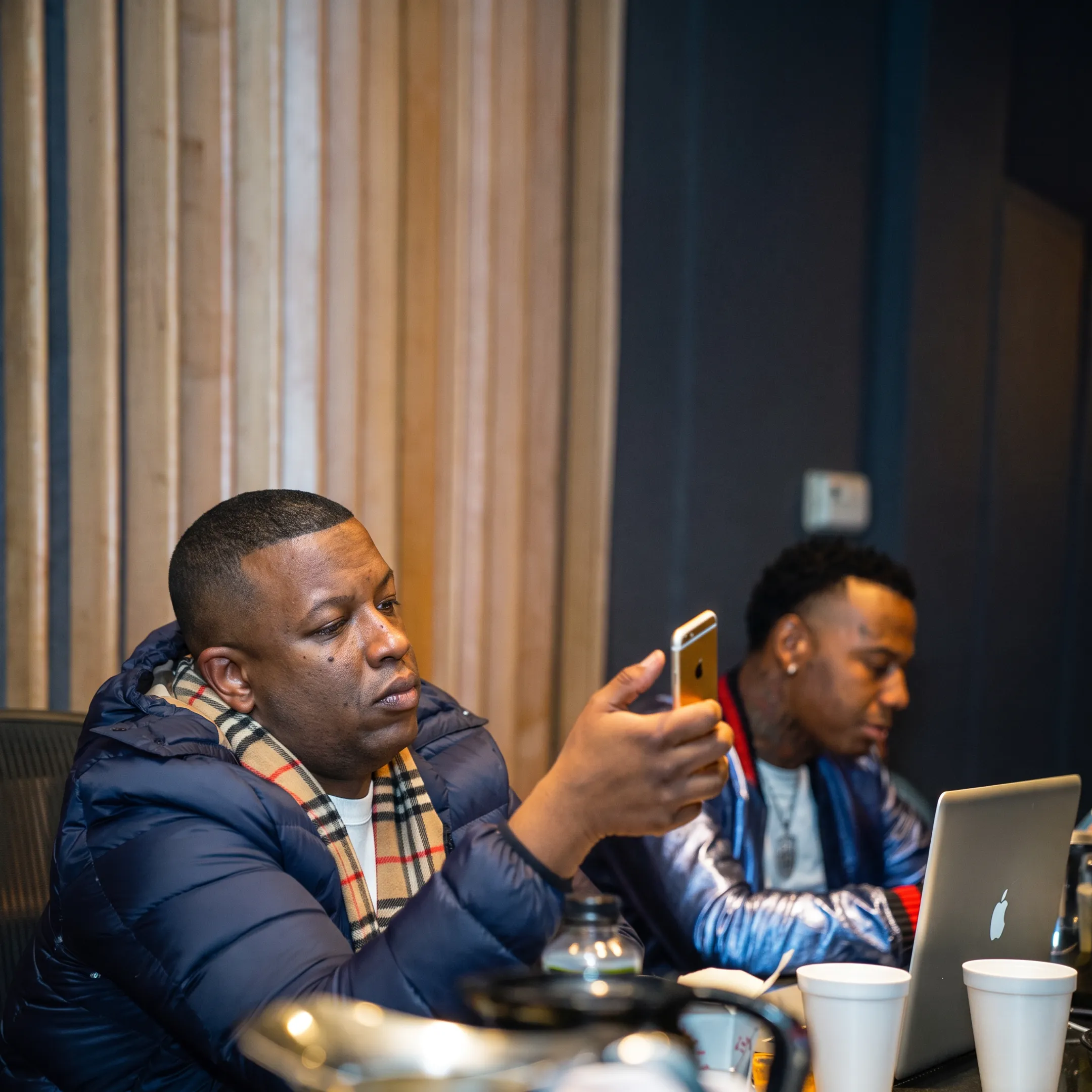 Music promotion team planning an artist campaign with creative materials and release strategy documents