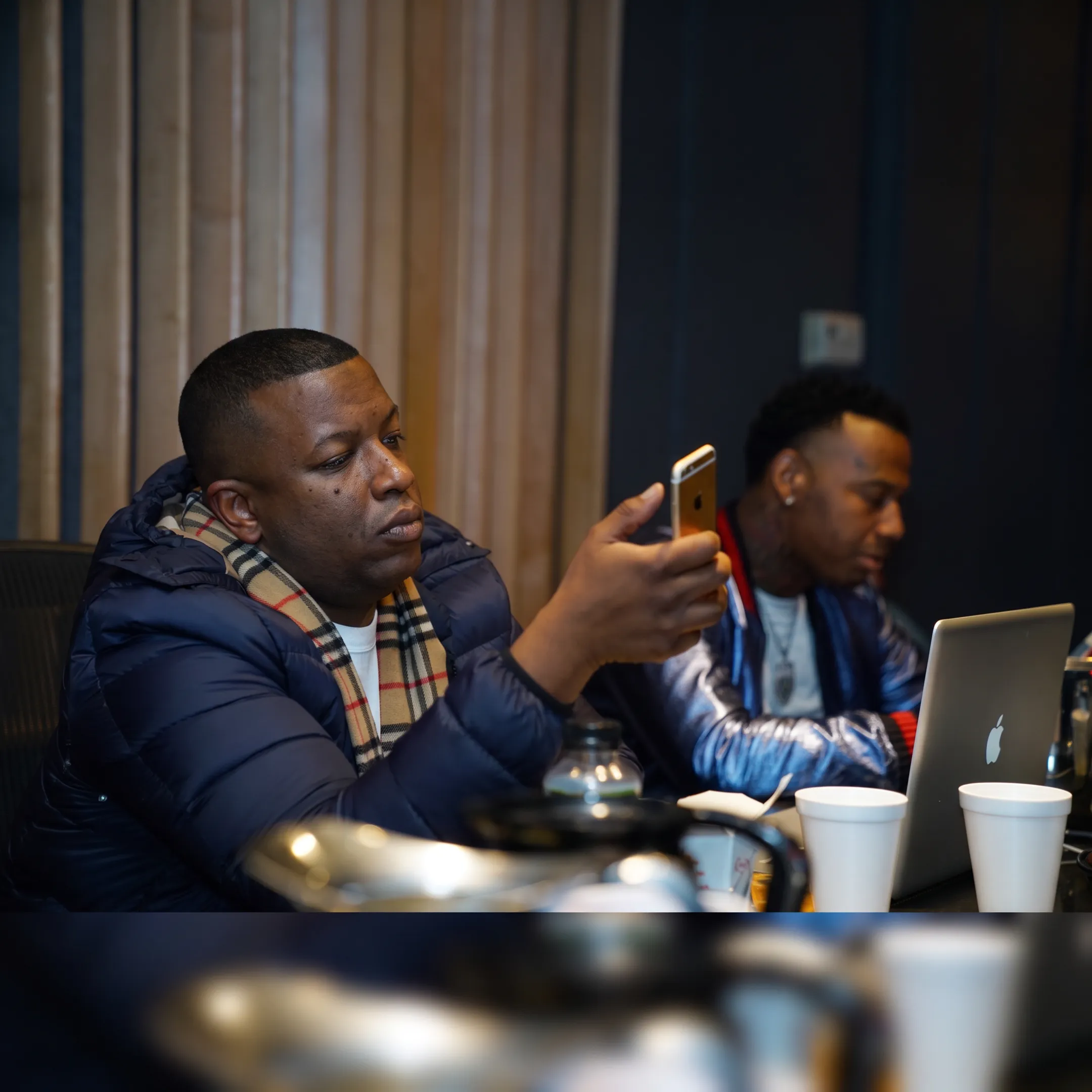 Entertainment manager meeting with recording artist in a Los Angeles studio