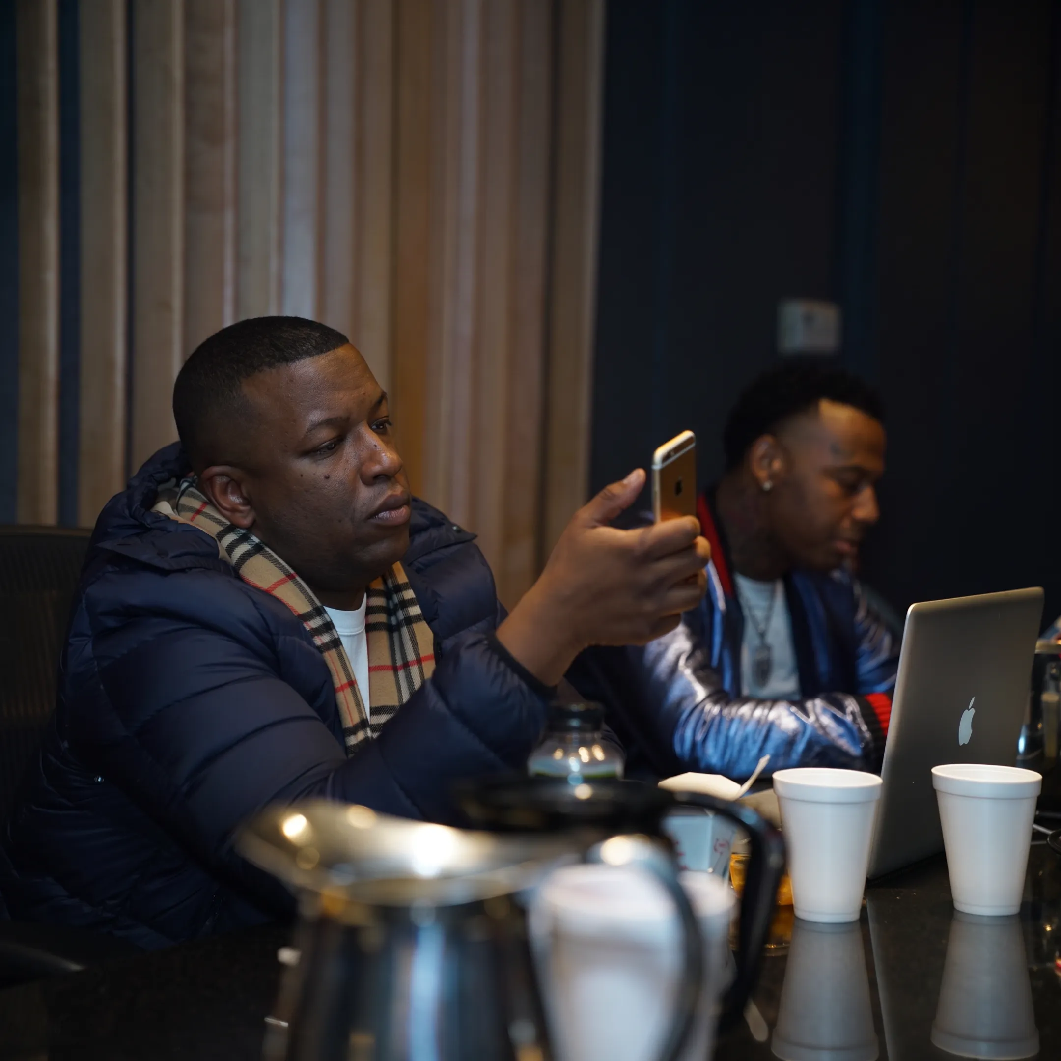 Booking professional coordinating a rap concert with artist and venue representatives
