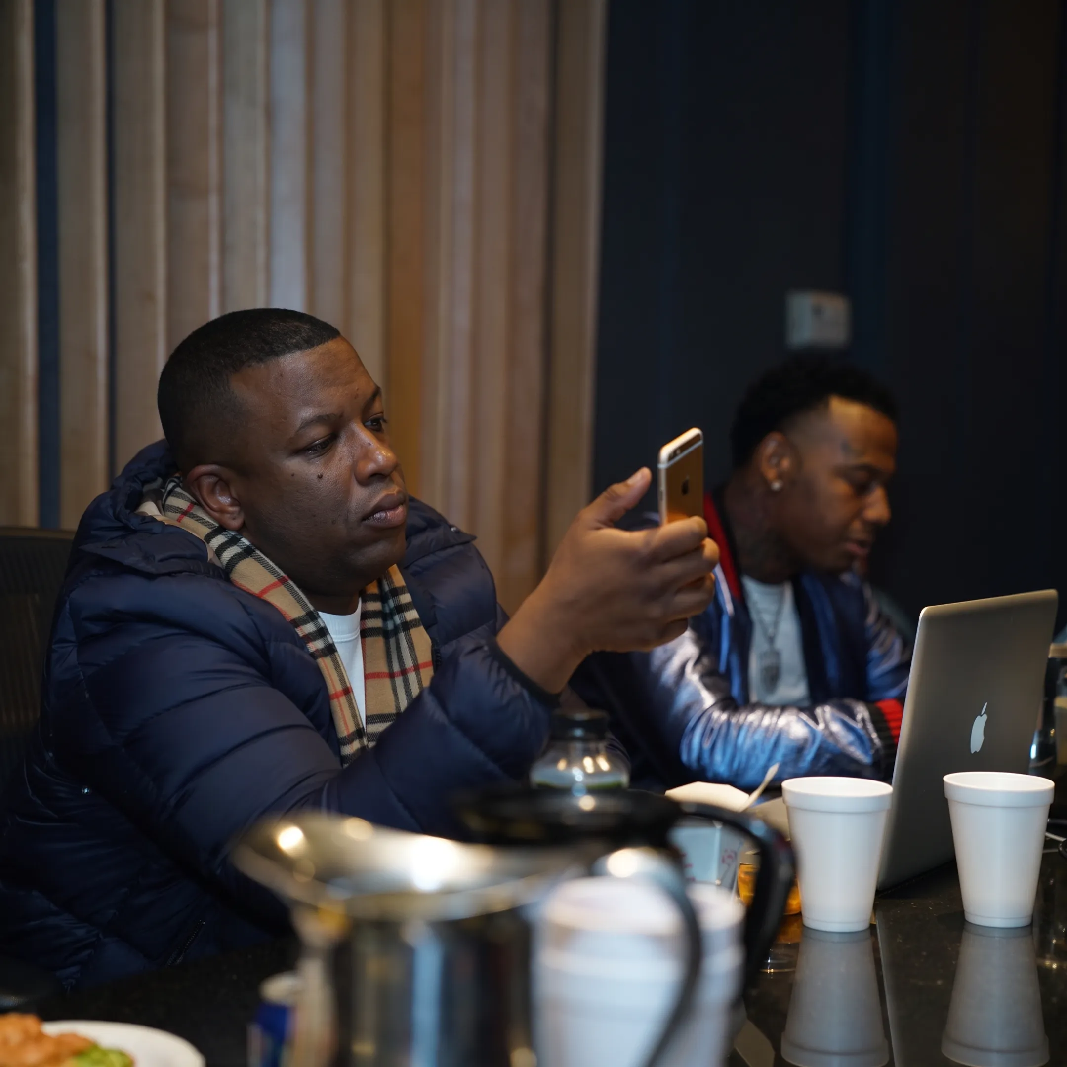 Music management team reviewing artist campaign plans
