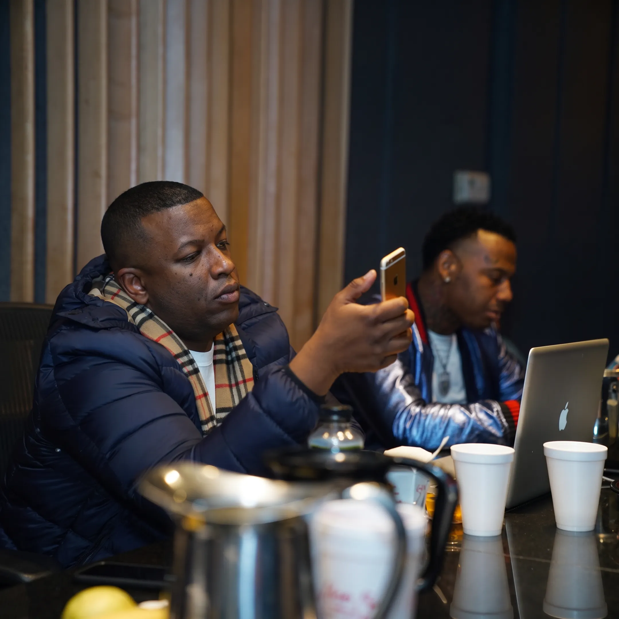 Music manager meeting with Houston artist in a creative studio