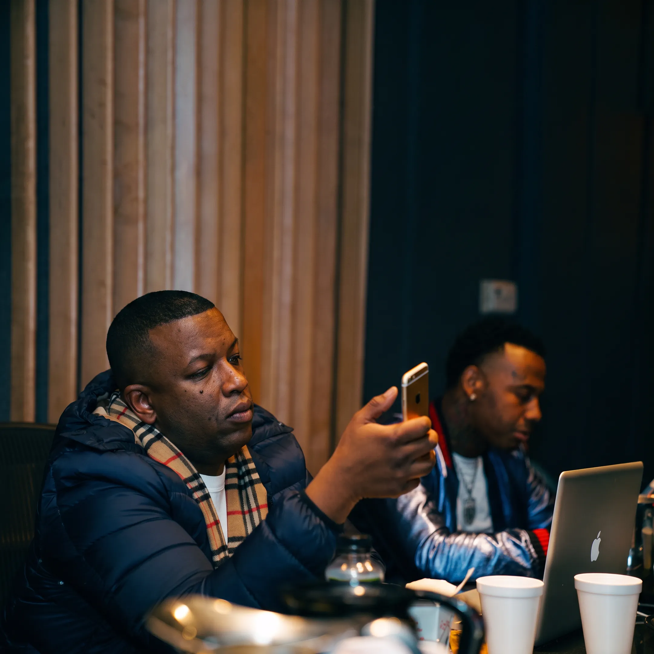 Music promotion team planning an artist campaign with creative assets and release strategy materials