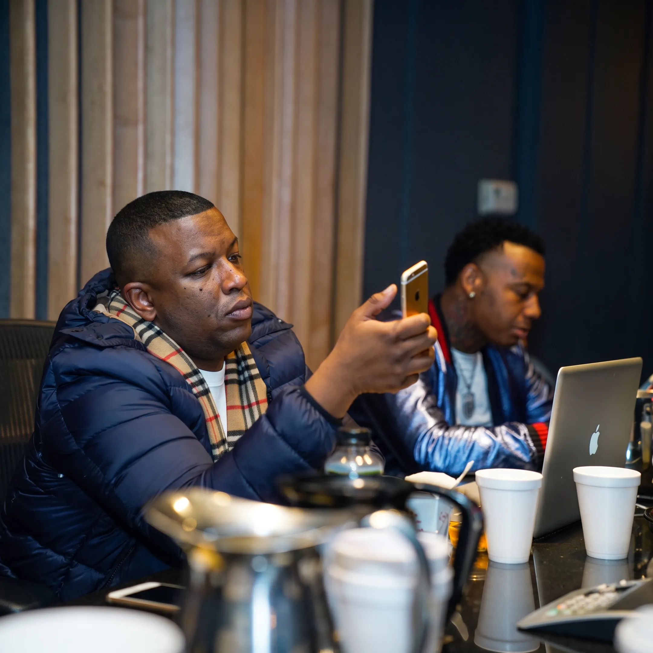 Entertainment production professionals planning a concert with artists and event materials