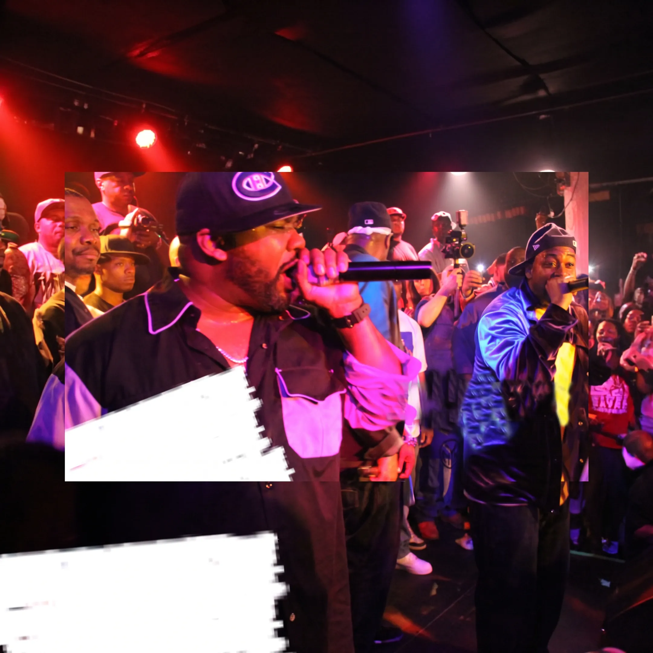 Artist performing onstage at an Atlanta concert while booking professionals coordinate the event