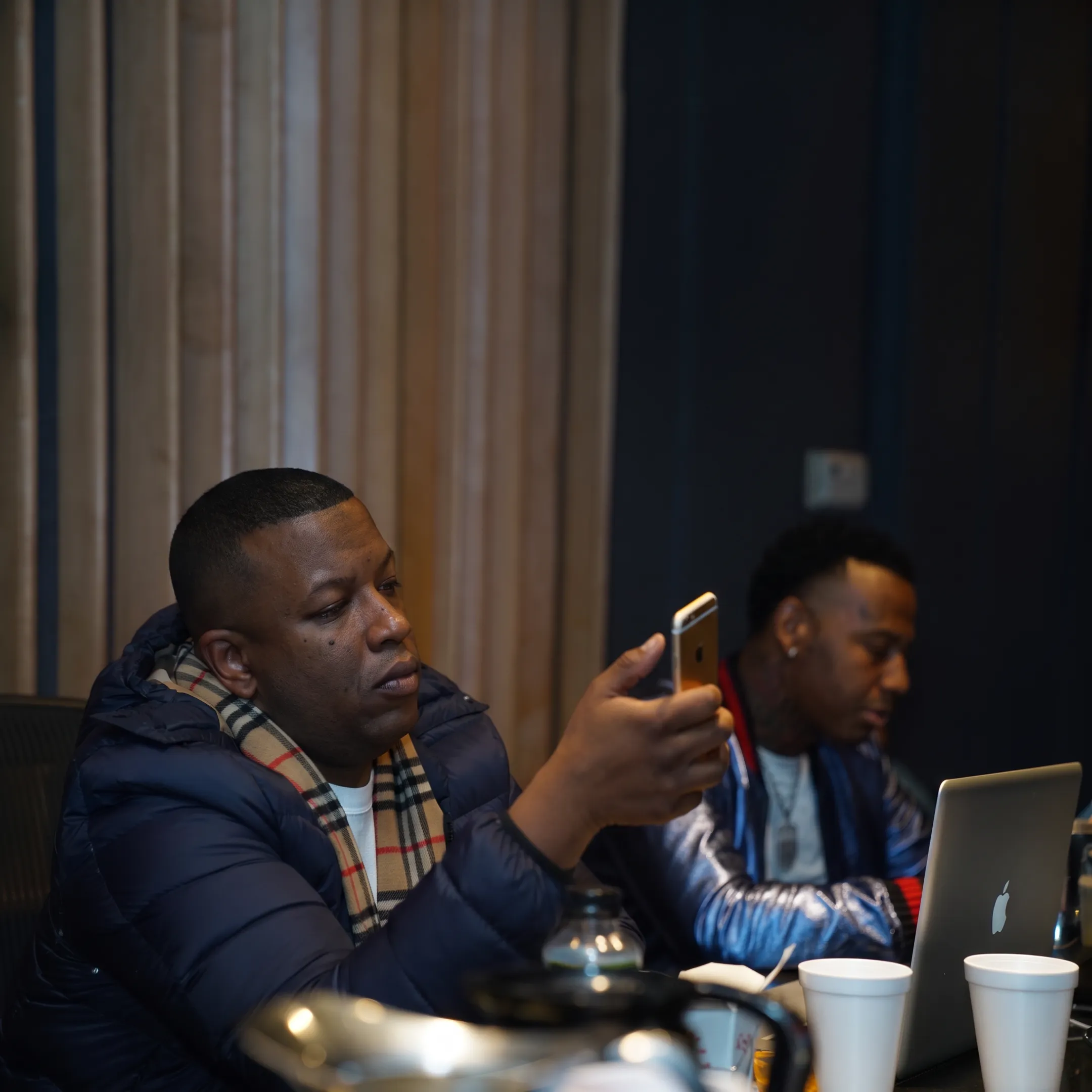 Entertainment consultant discussing artist marketing strategy with a client