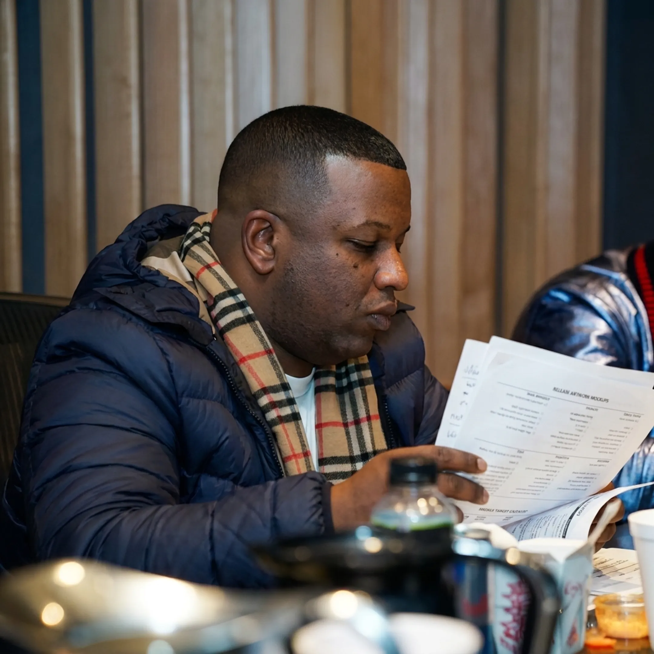 Entertainment consultant planning an independent artist music promotion campaign with release artwork and strategy notes