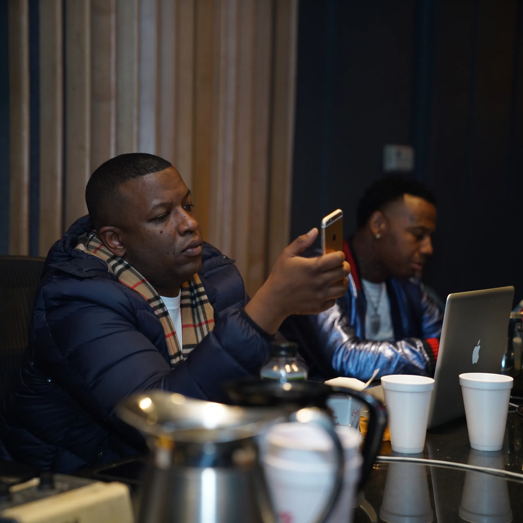 Artist and music consultant discussing a career growth plan at a studio table