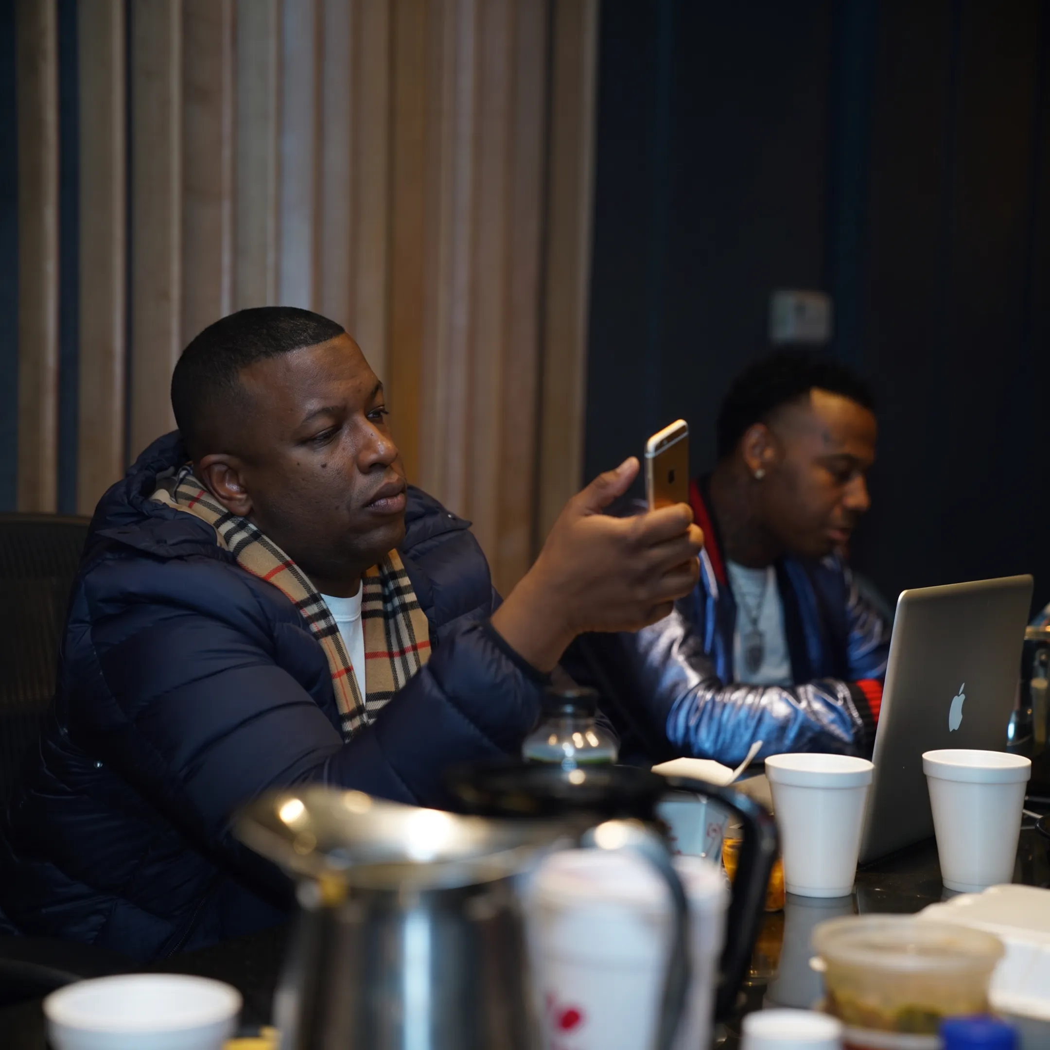 Music artist reviewing a digital promotion campaign with a creative strategist