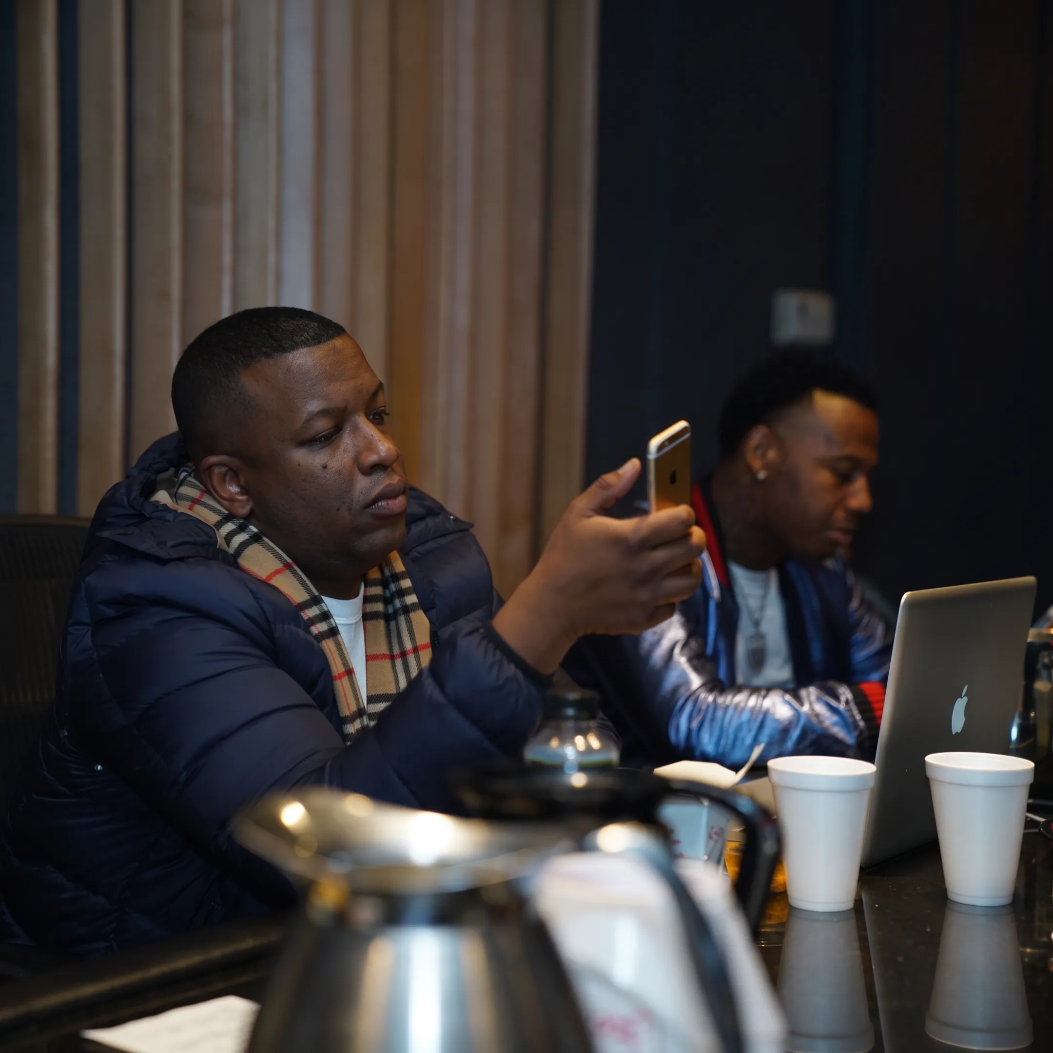 Music manager meeting with an artist in a Boston recording studio