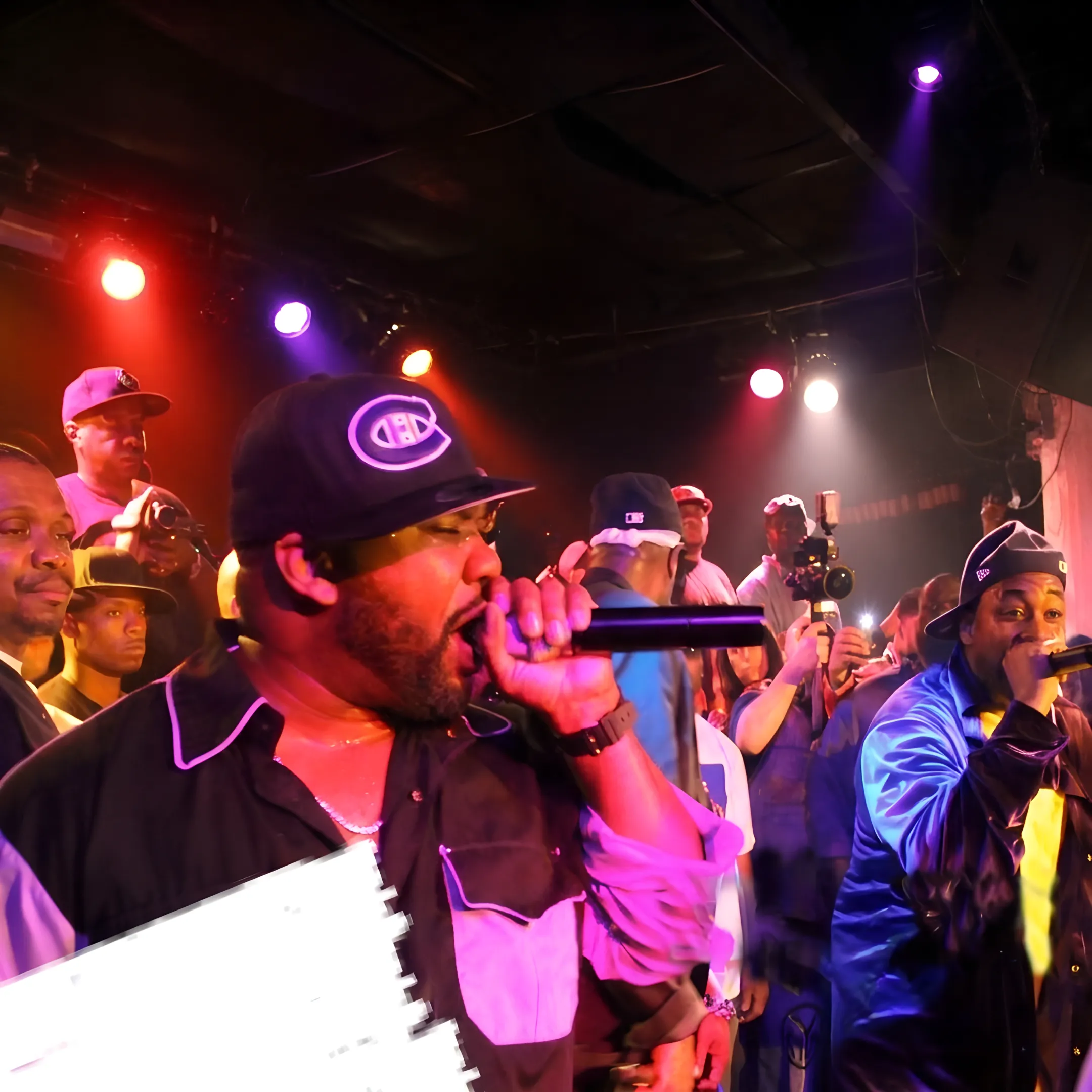 Independent artist performing onstage at a packed concert venue