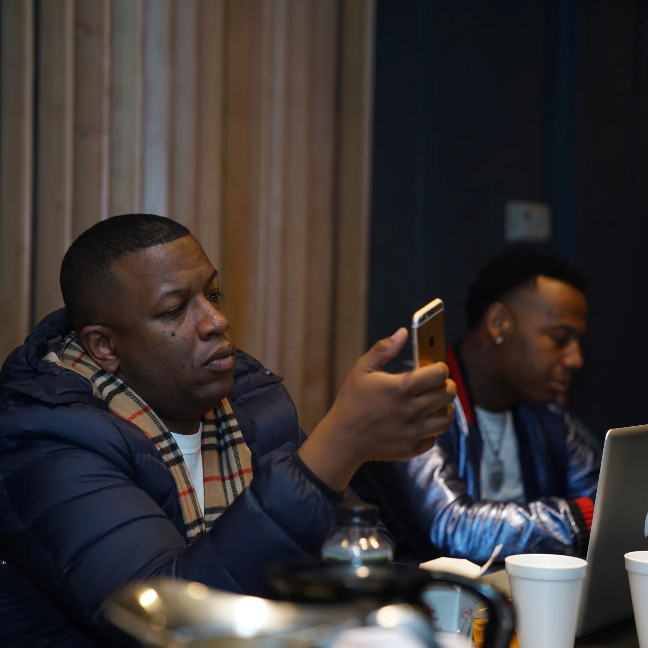 Independent music artist recording Tik Tok promotional content in a creative studio