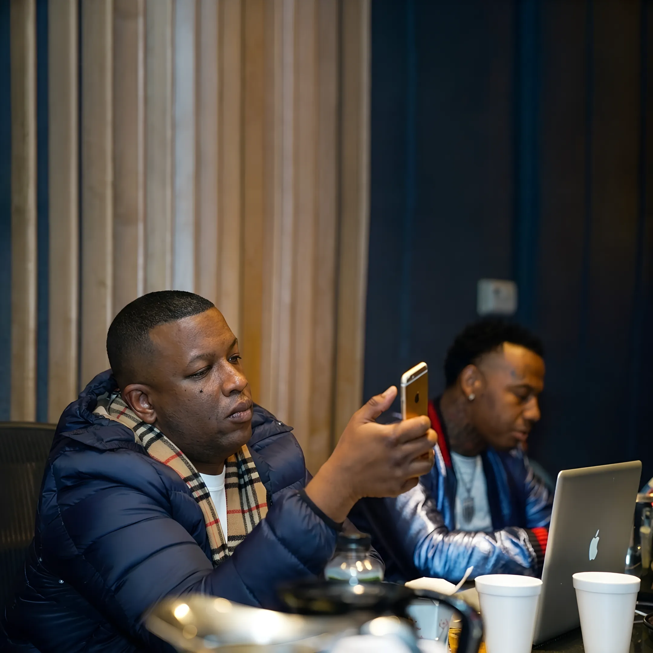 Music manager advising a hip-hop artist on branding and career development