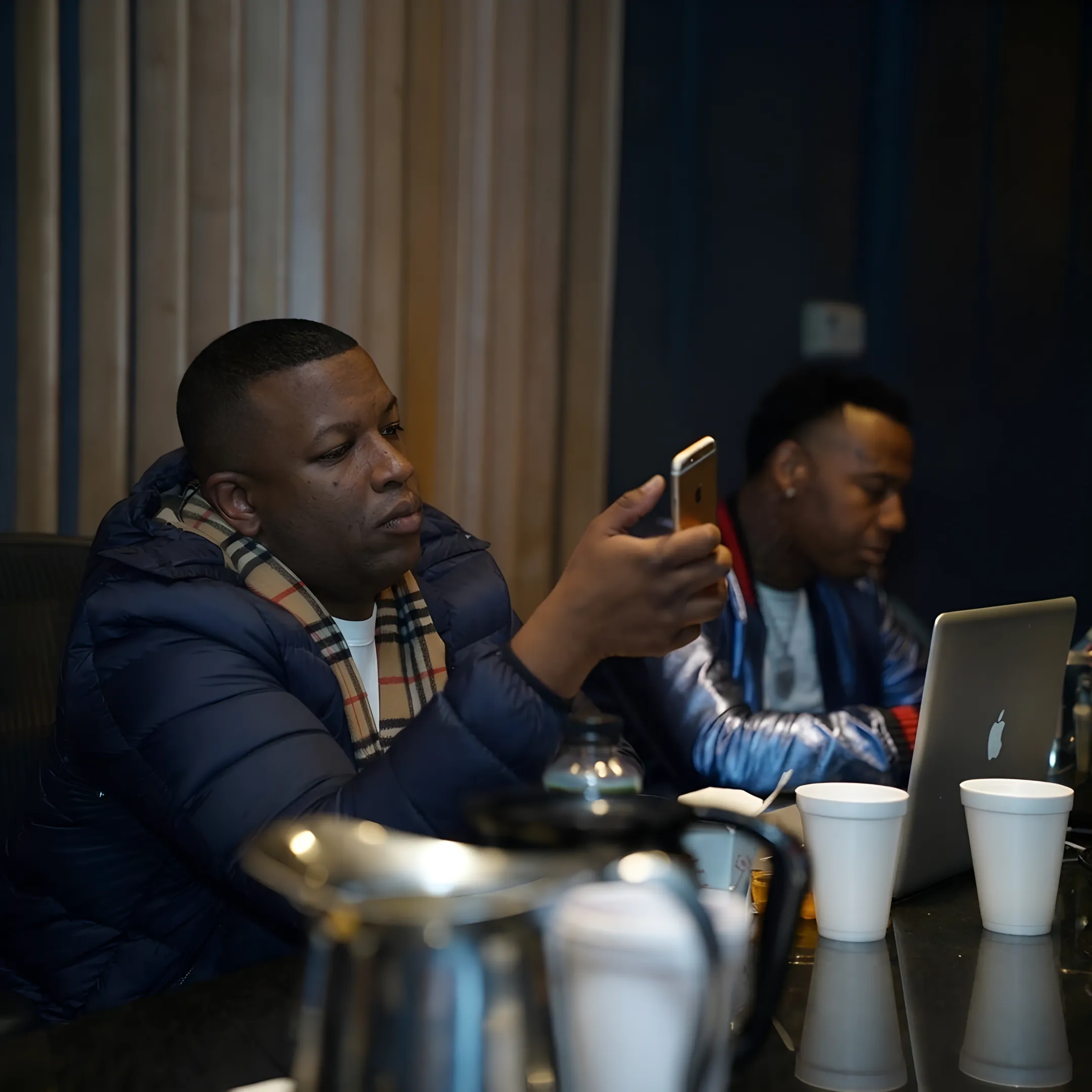 Independent artist reviewing music promotion strategy with entertainment consultant