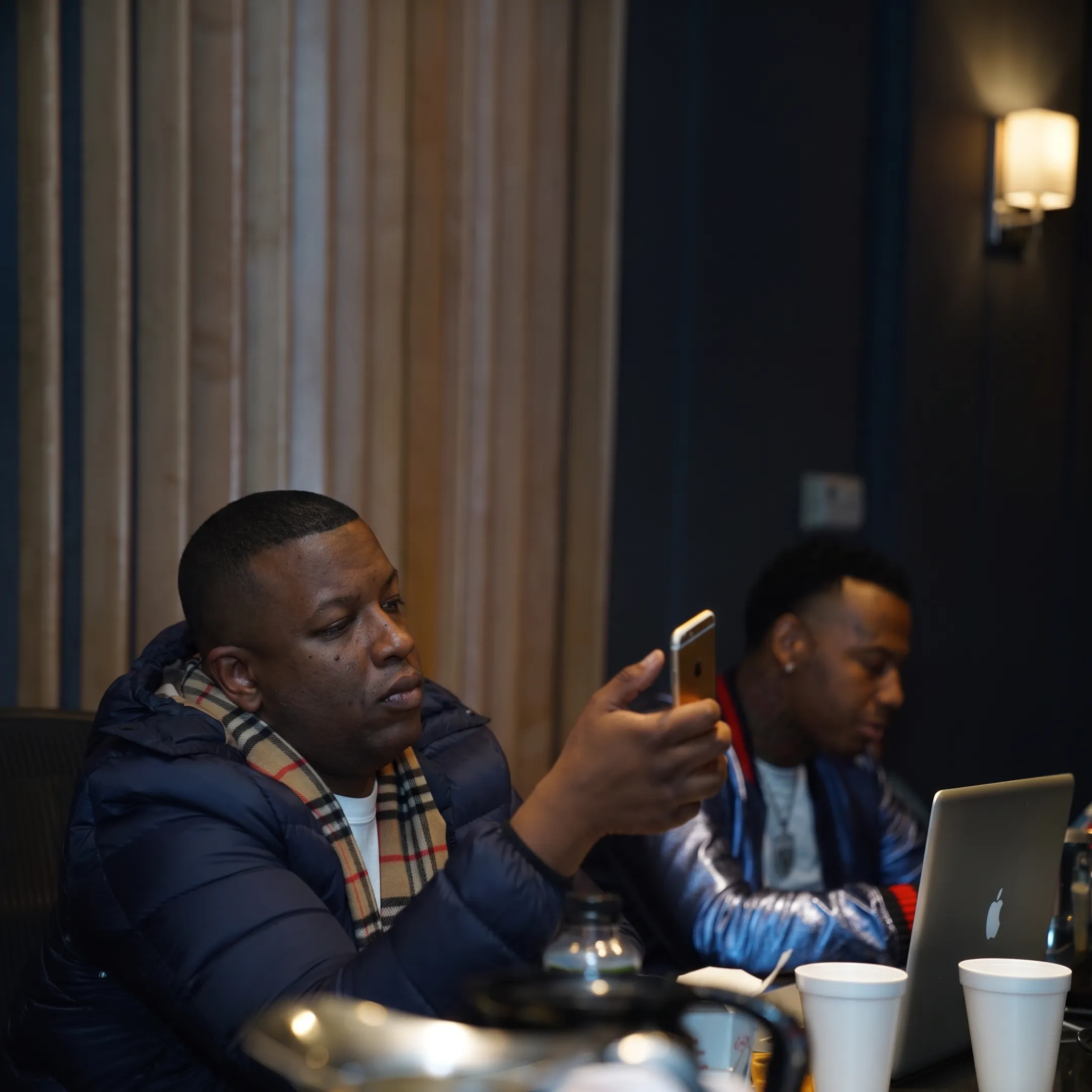 Independent artist reviewing an album release campaign with a music marketing consultant