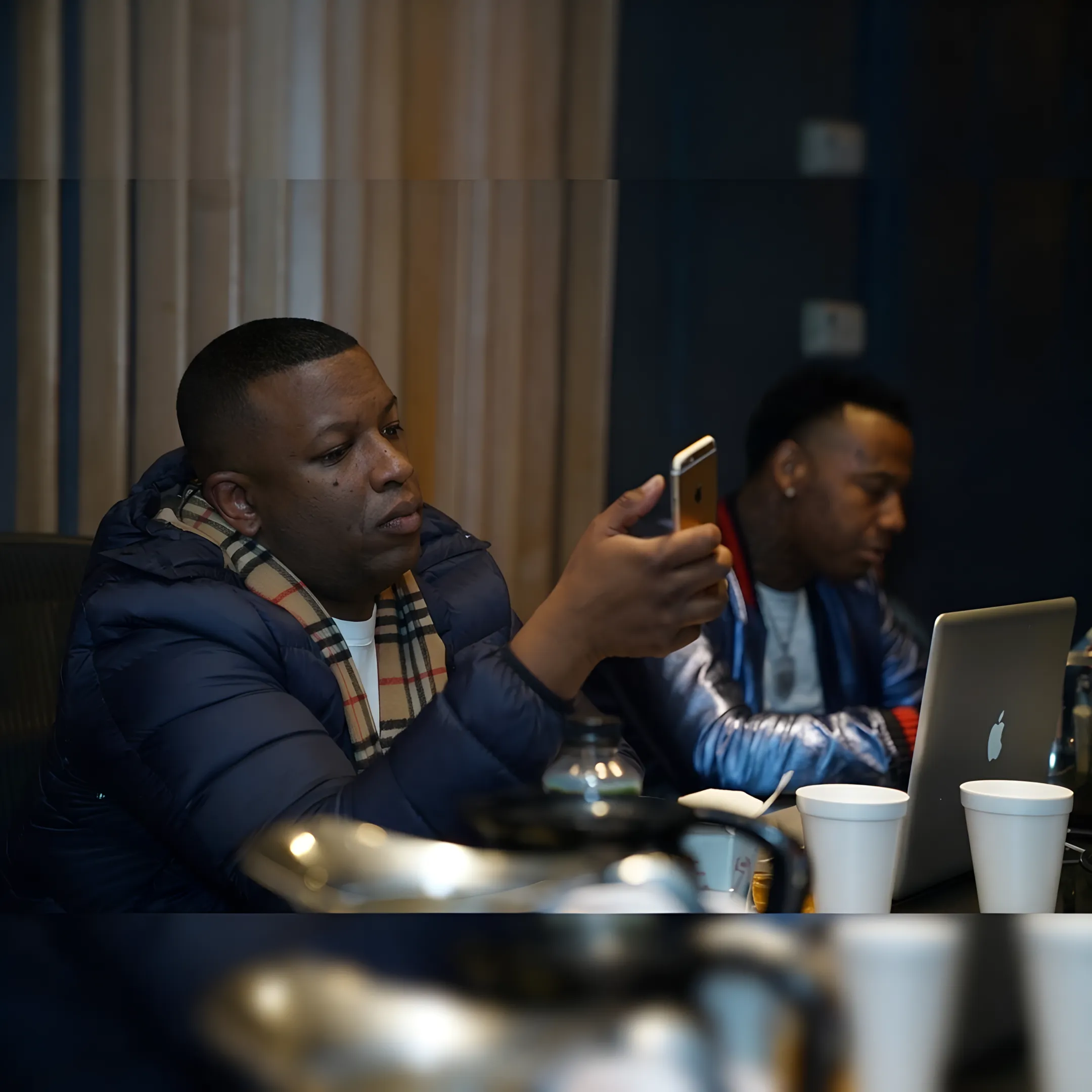 Independent hip hop artist planning a music marketing campaign with a consultant