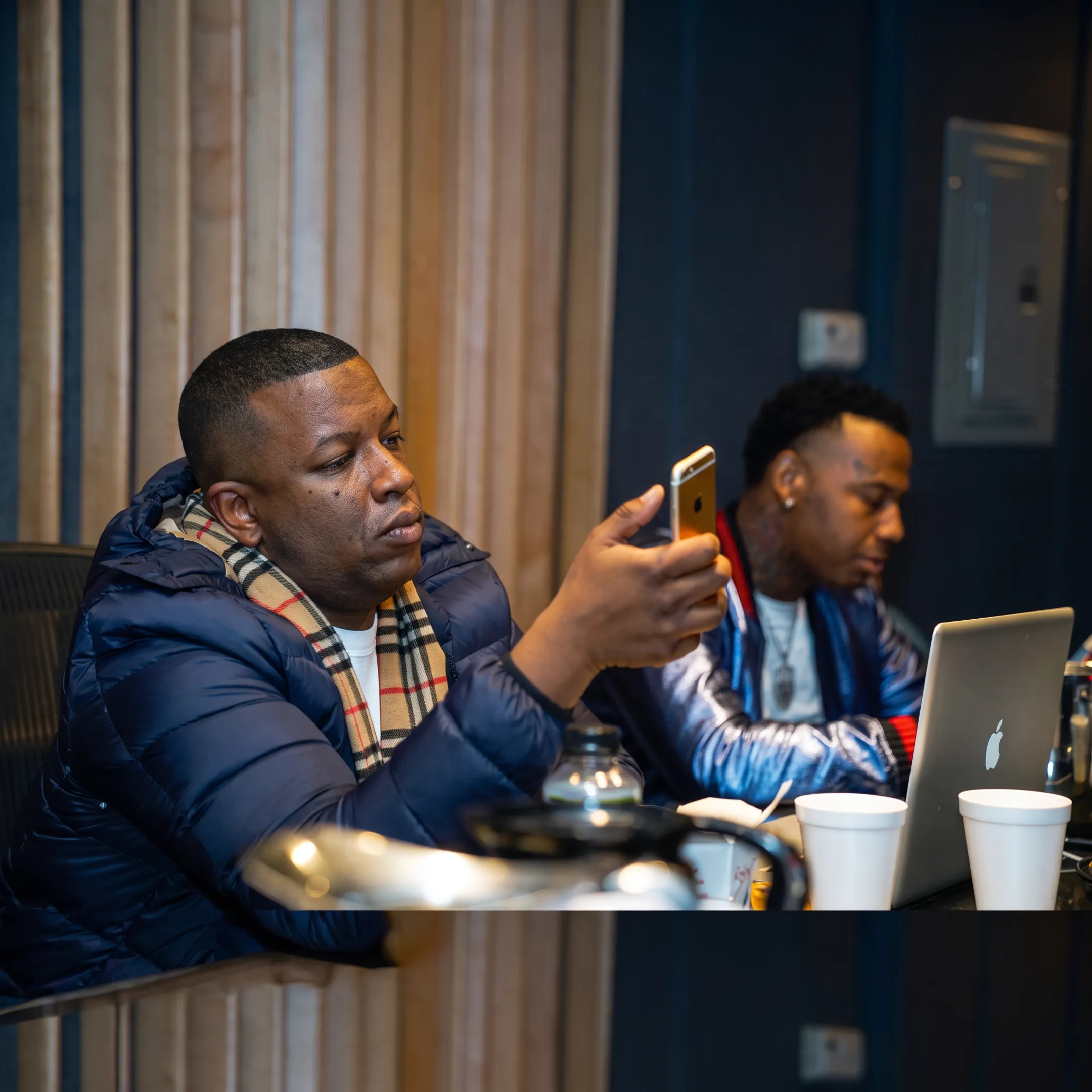 Artist reviewing a music marketing campaign and brand strategy with a consultant