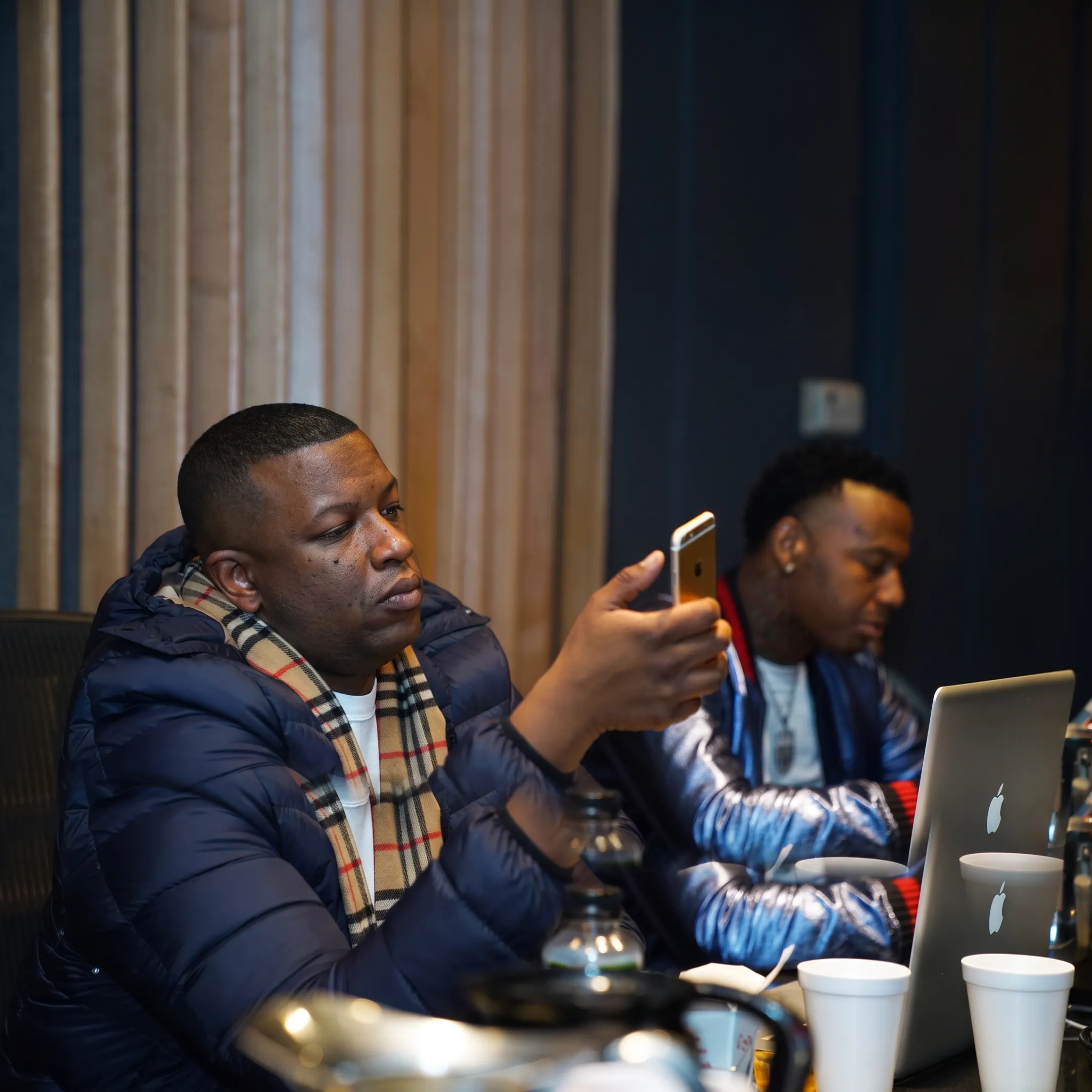 Music manager meeting with recording artist in a Chicago studio