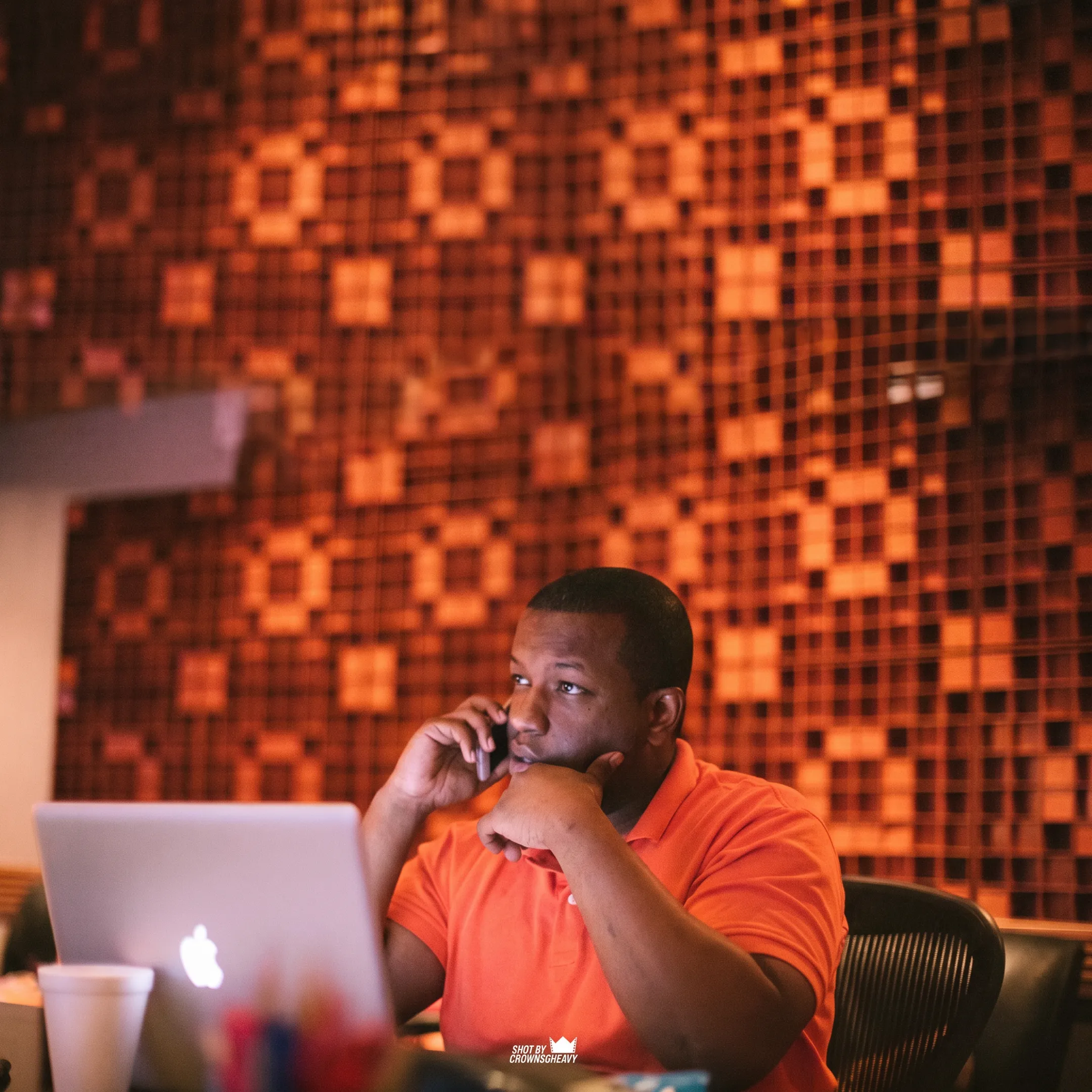 Independent artist reviewing a music promotion campaign with an entertainment strategist