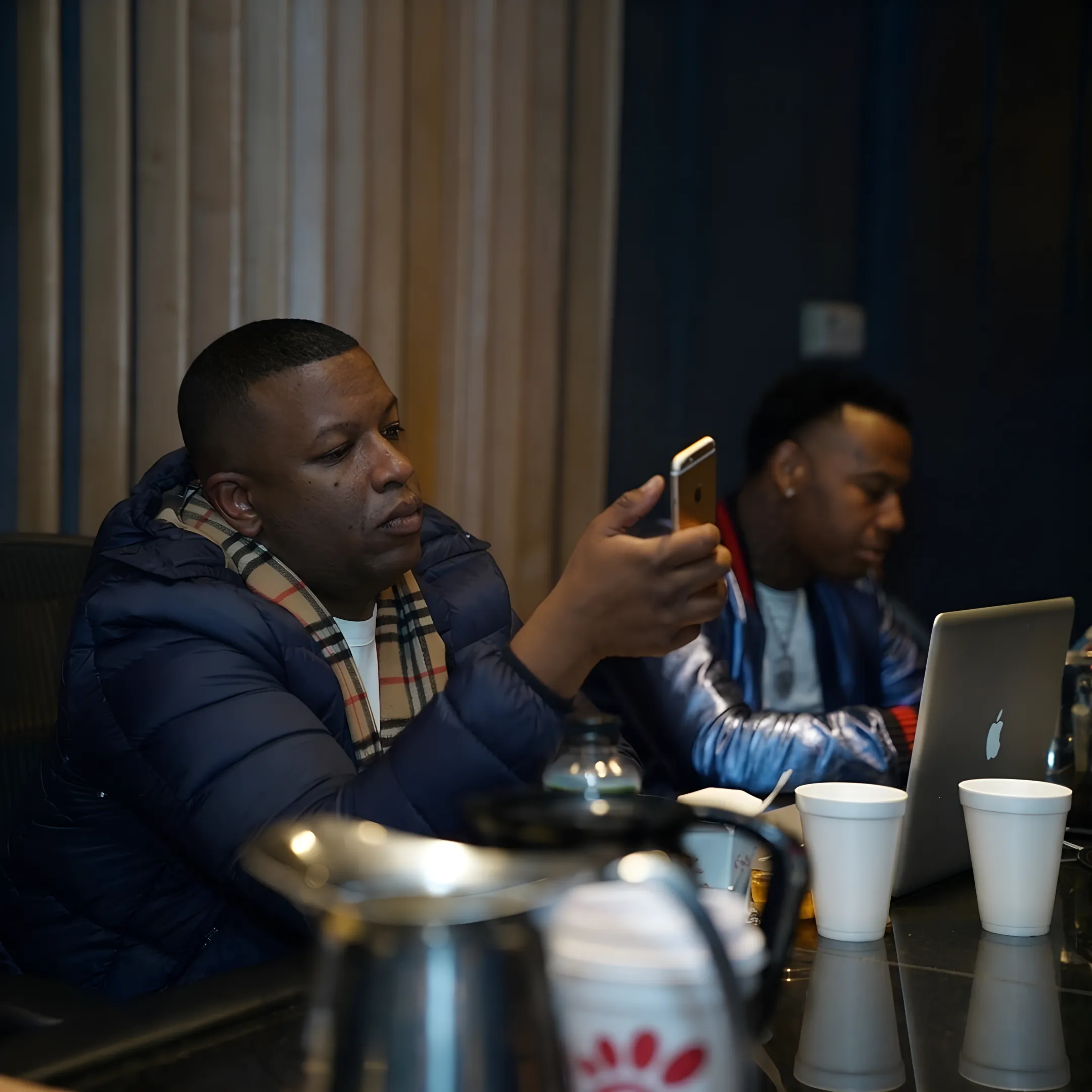 Artist manager planning a release campaign with a musician and creative team