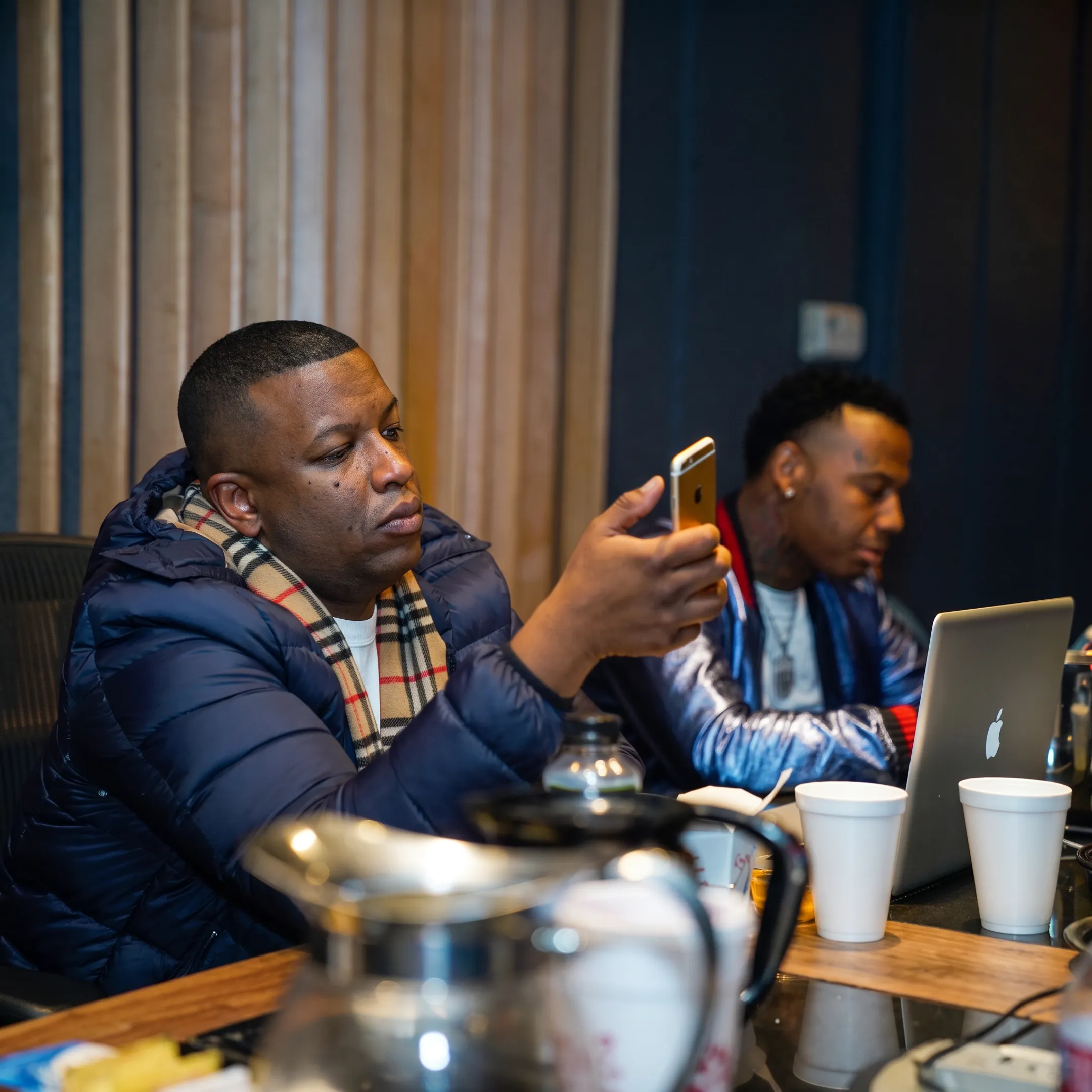 Music promotion team reviewing an independent artist campaign in a creative studio