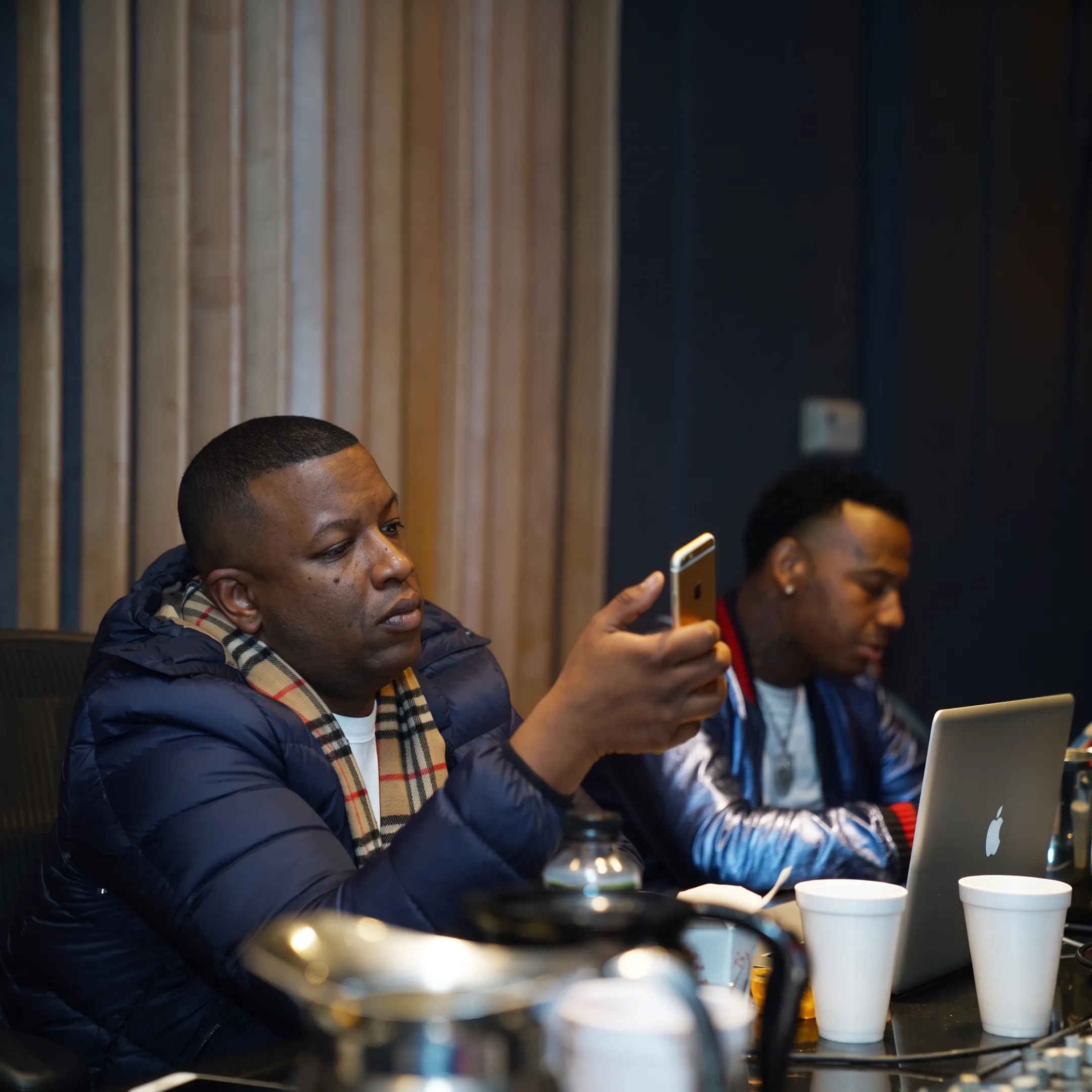 Artist manager discussing career strategy with a musician in a London studio