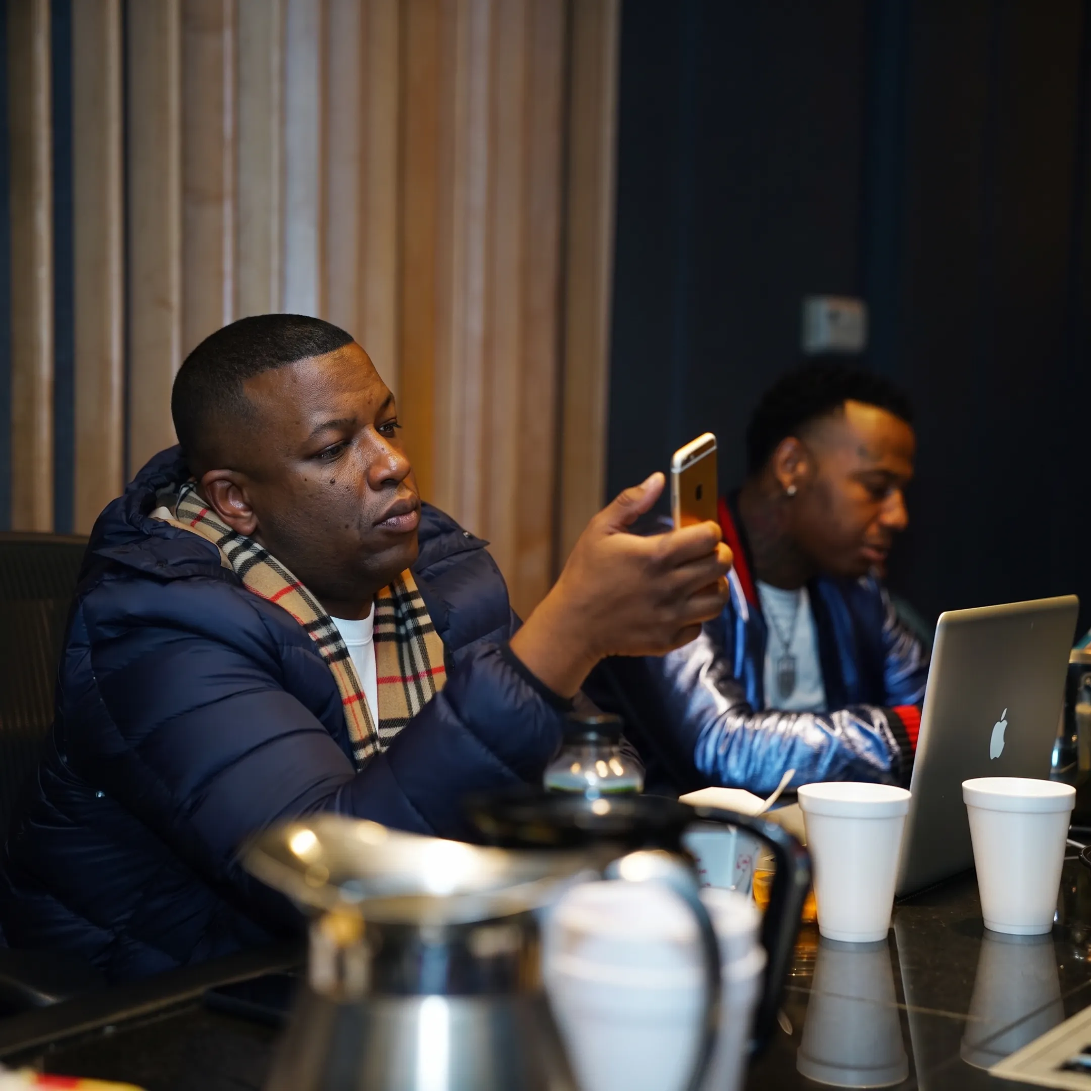 Music manager planning an artist campaign with notes and release materials