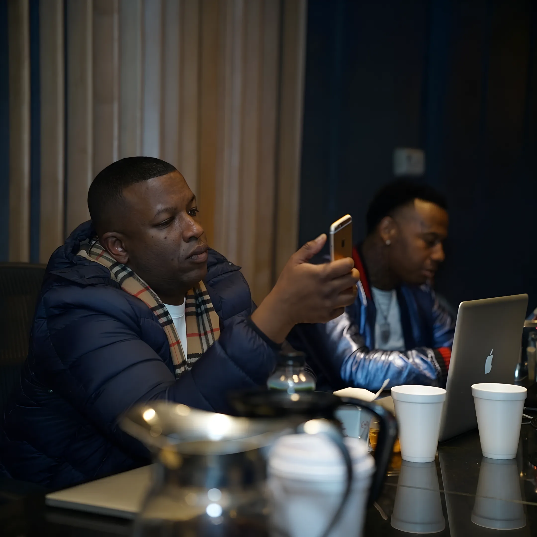 Rapper and music consultant planning a coordinated release campaign with notes and digital content