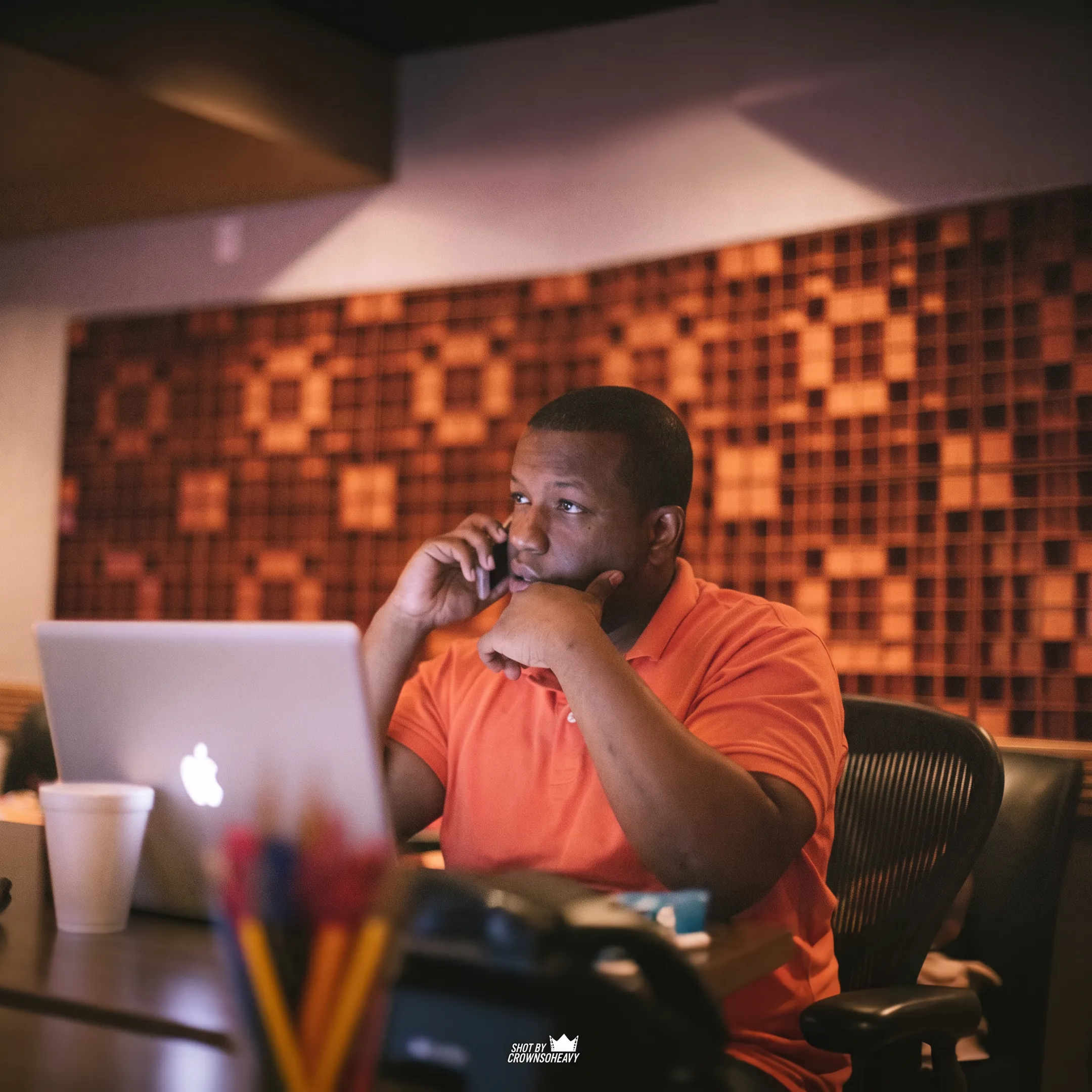 Artist and entertainment consultant discussing release strategy with notes and music materials
