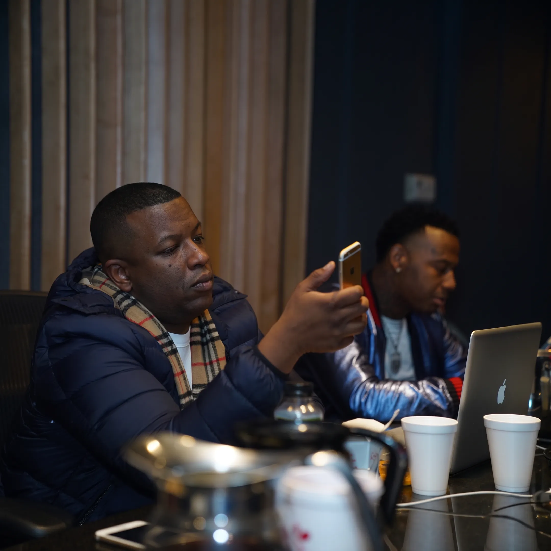 Artist manager meeting with a musician in a Denver studio