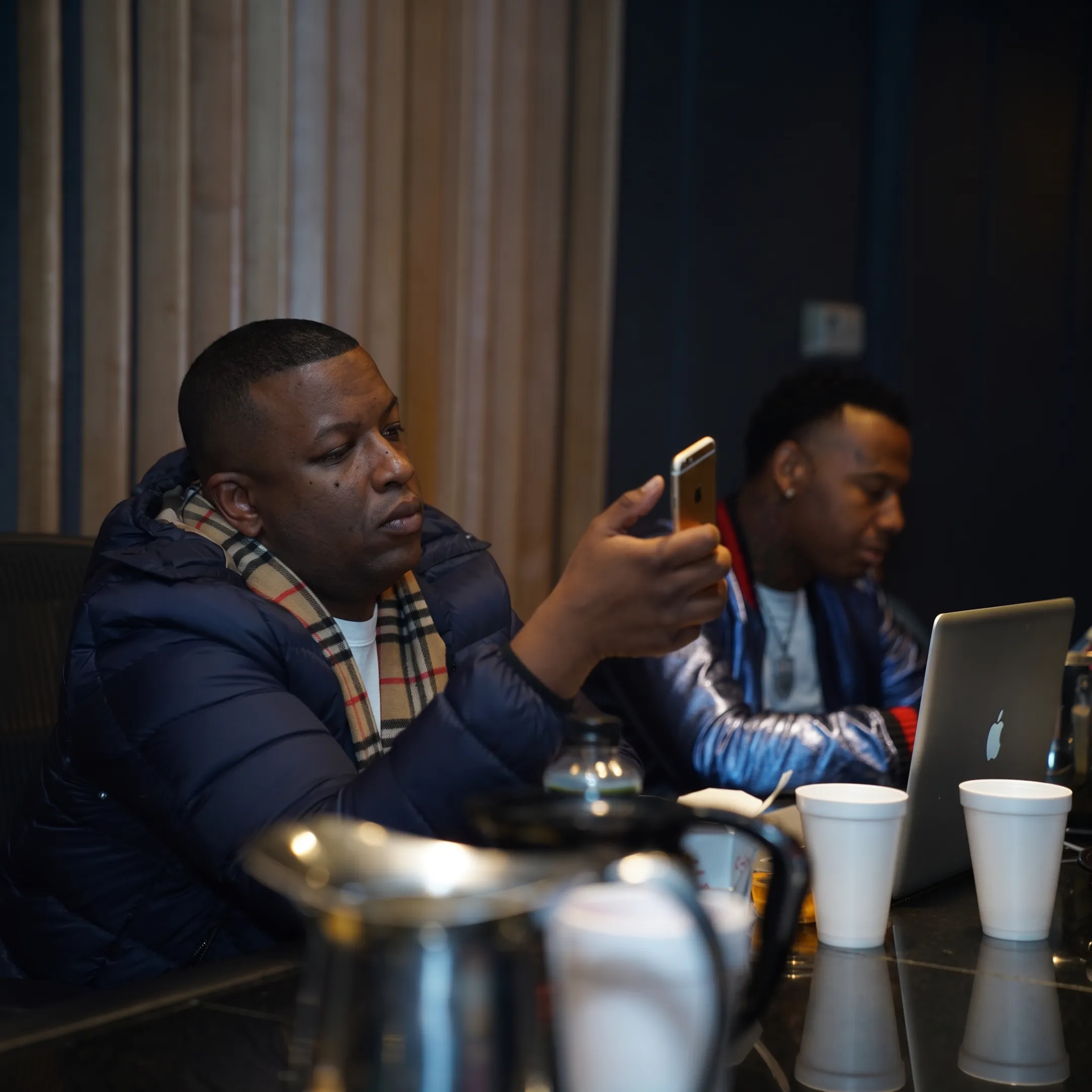 Artist reviewing music development plans with an entertainment consultant in a Chicago studio