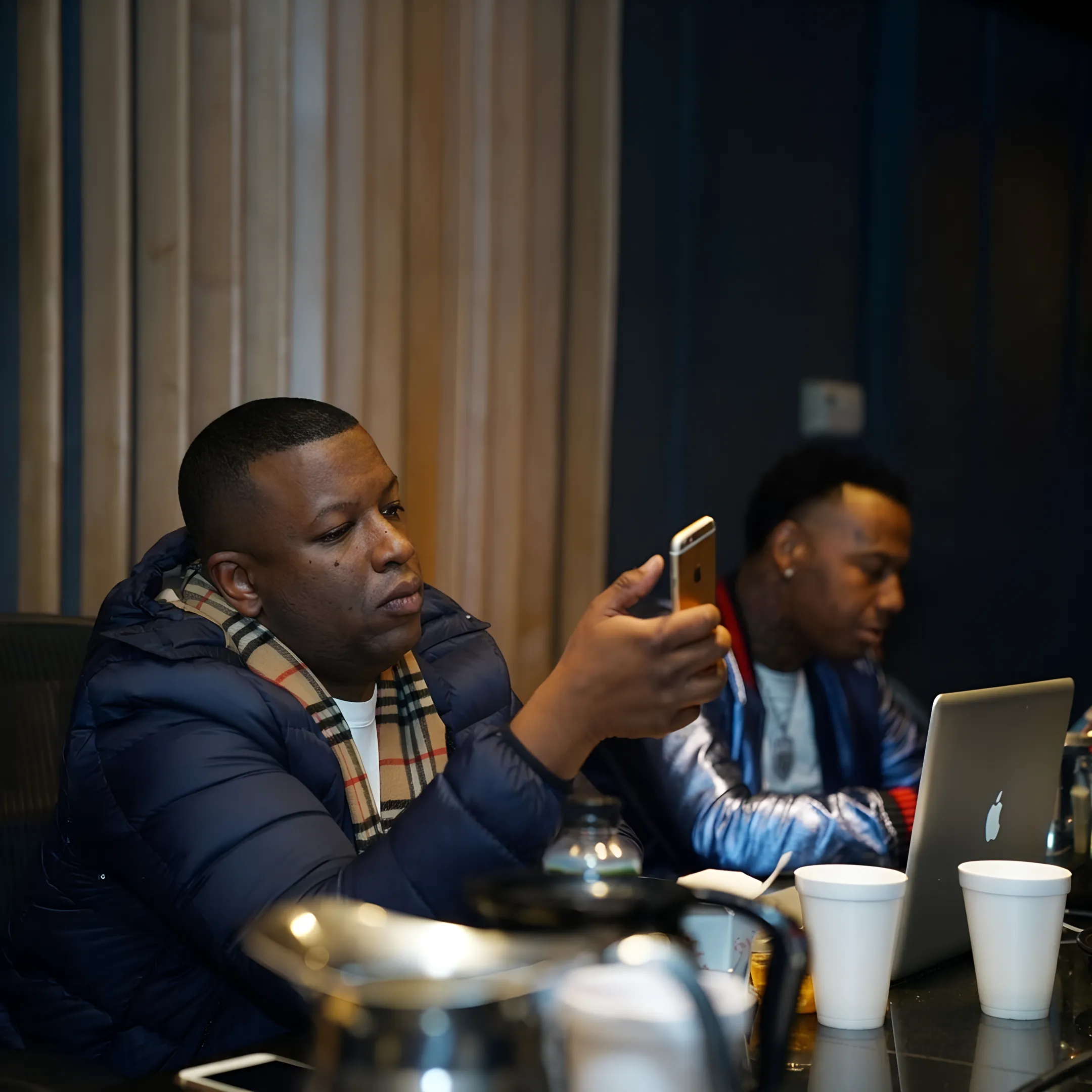 Independent hip-hop artist planning a media campaign with a PR consultant