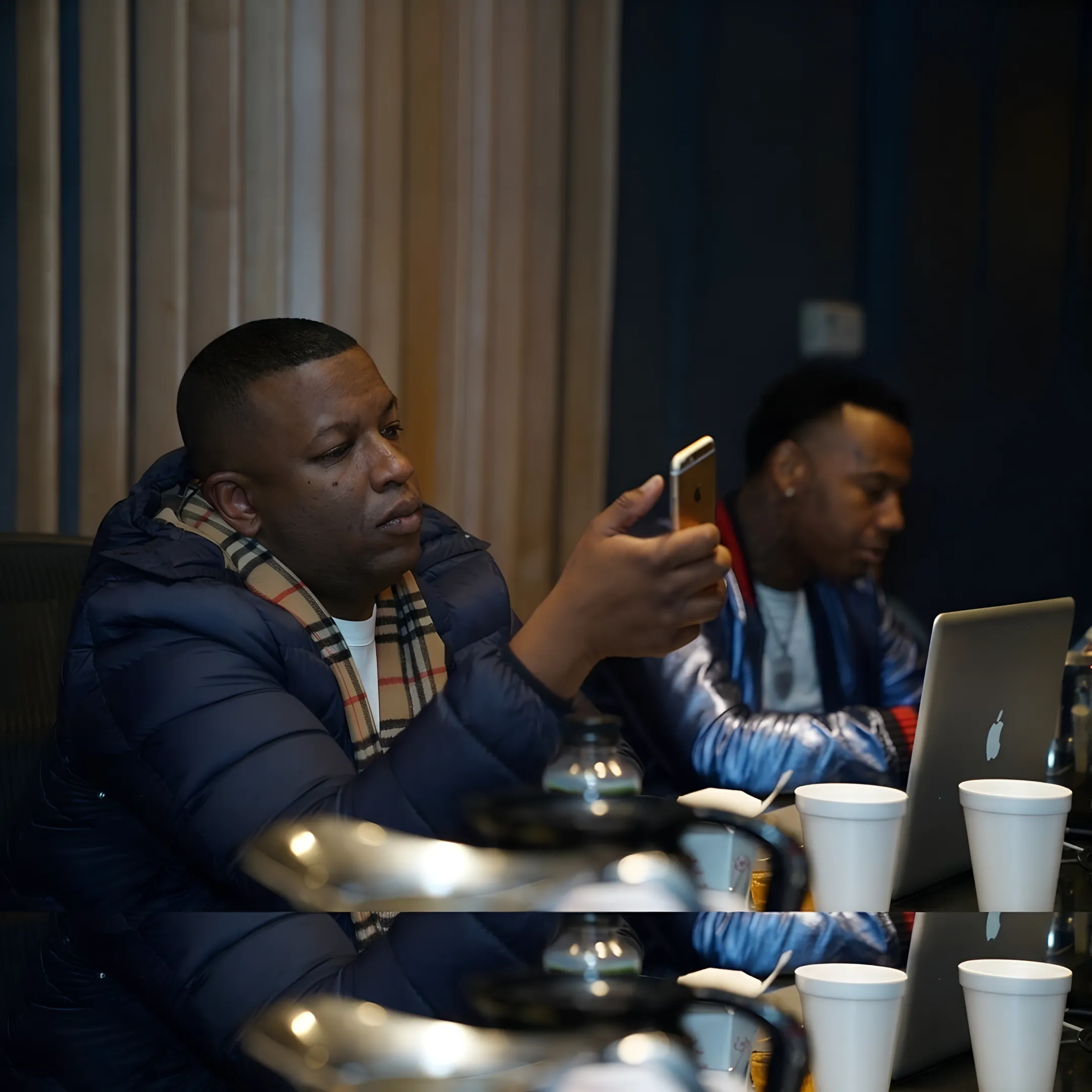 Artist and entertainment manager reviewing a performance strategy together
