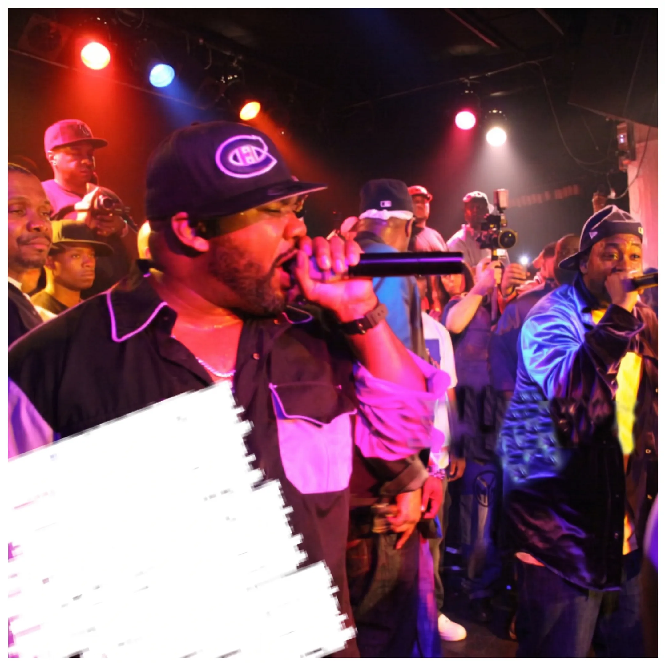 Independent artist performing onstage before an engaged live music audience